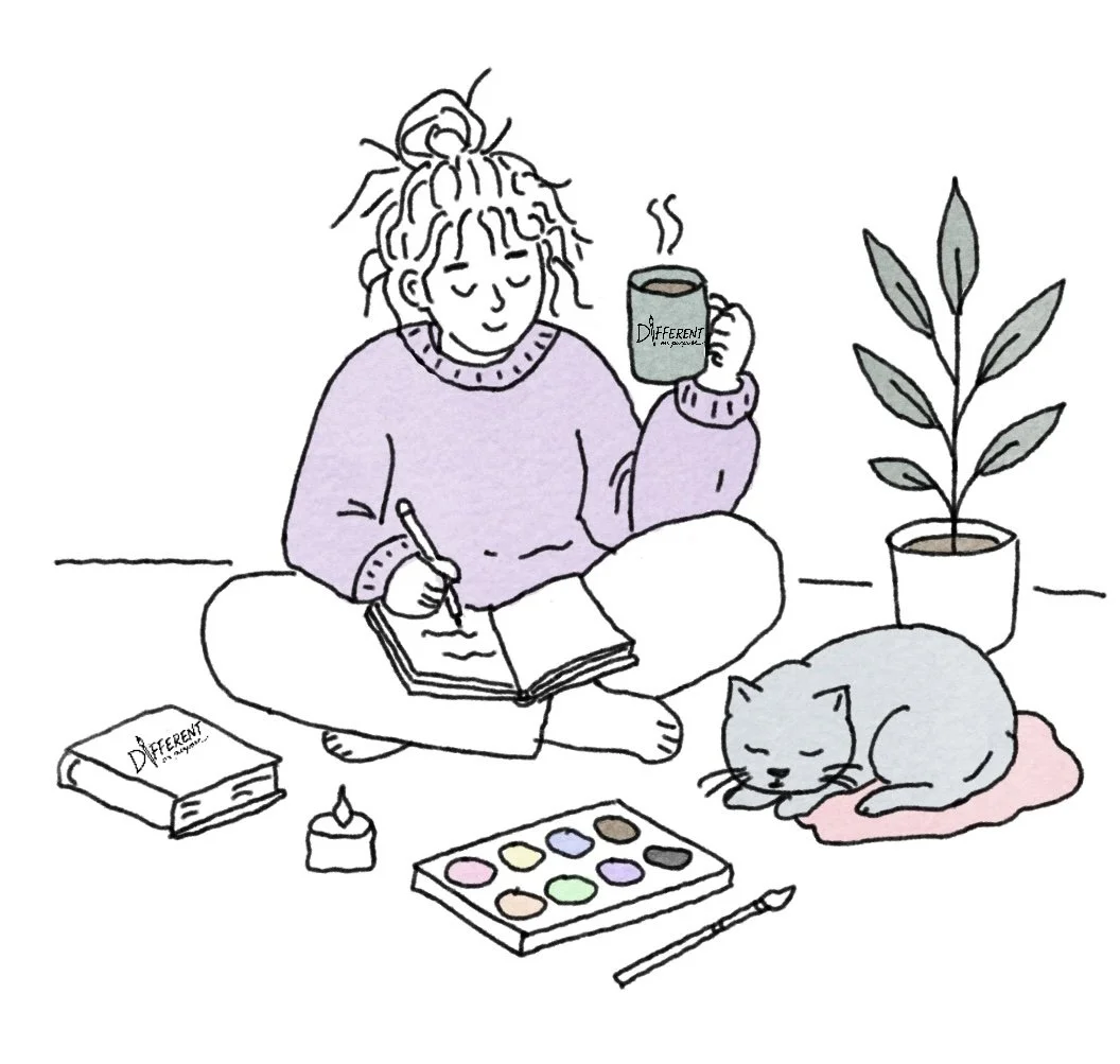 Illustration of person writing in a journal with watercolor paints, a mug, books, and a sleeping cat, representing the Words On Purpose Collection at Different On Purpose.