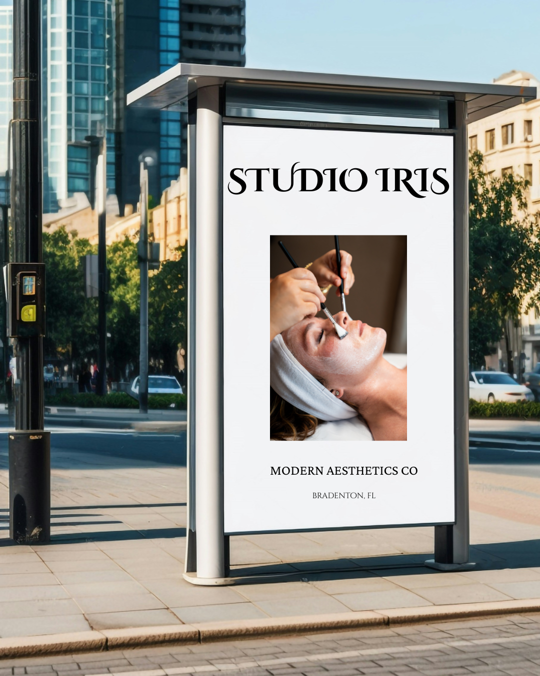 Bus stop advertisement for Studio Iris, a modern aesthetics beauty salon, with a photo of a woman receiving a facial treatment, located in Bradenton, Florida.