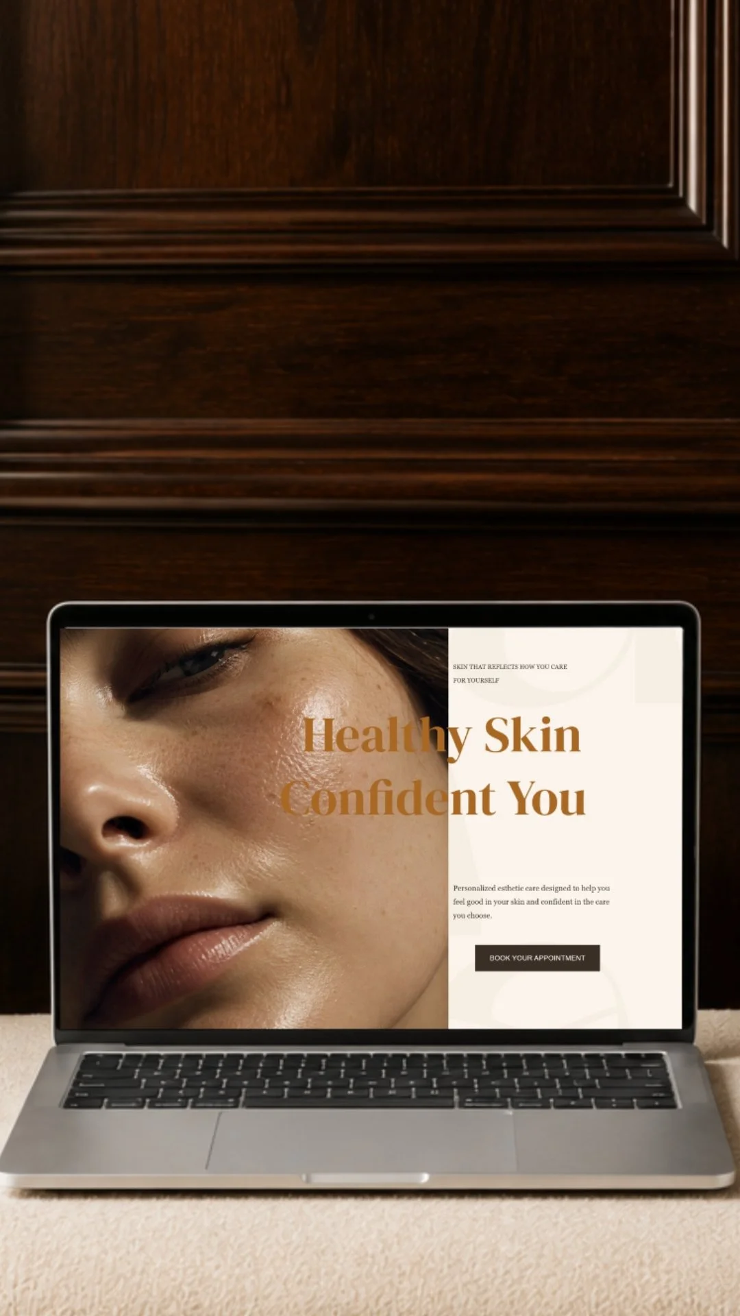 Laptop displaying a skincare website with a close-up of a woman's face and the text 'Healthy Skin Confident You'.