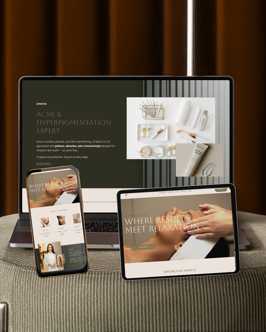Website homepage mockup shown on laptop, tablet, and phone