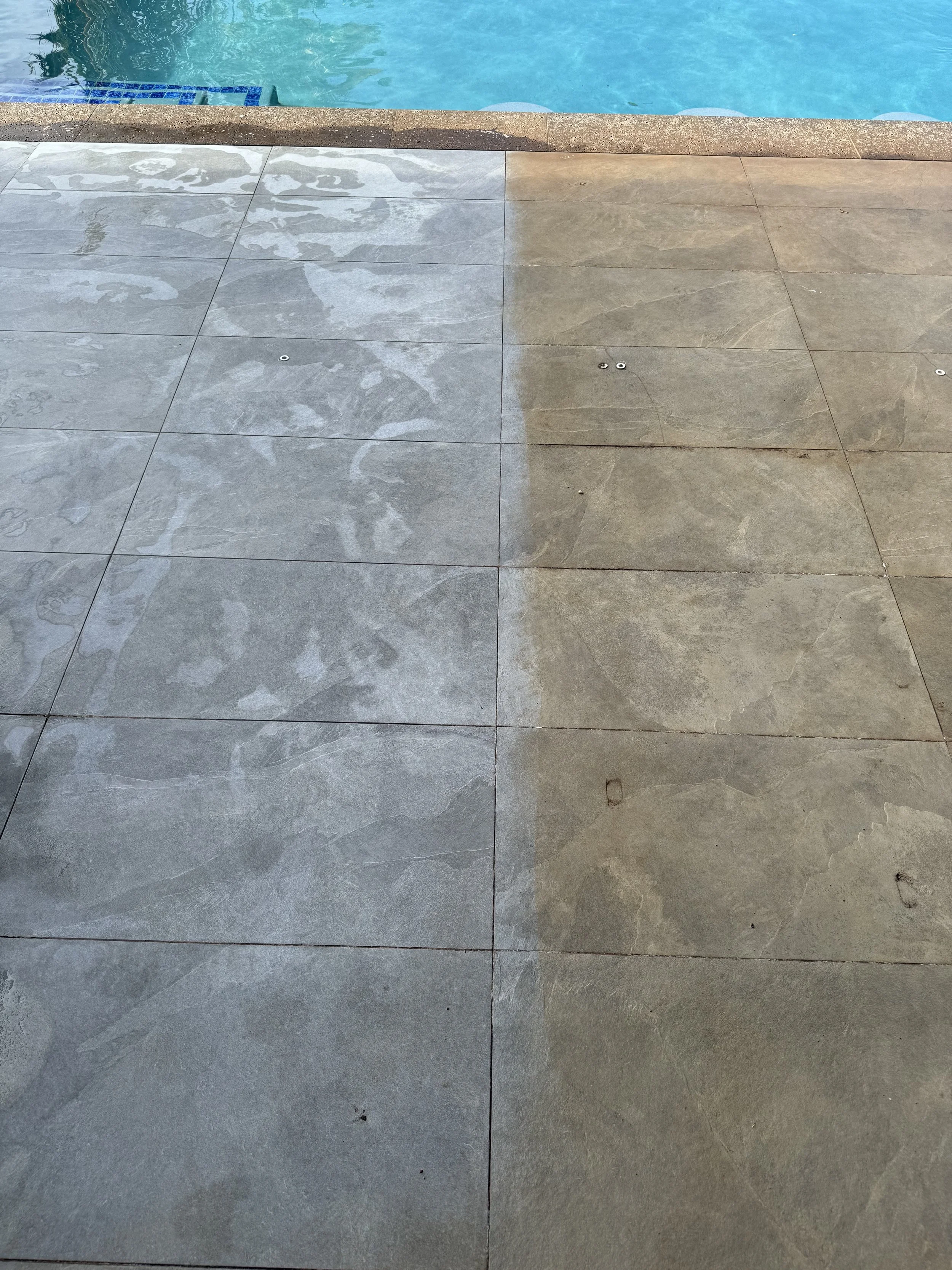 Comparison of clean and dirty tiles near a swimming pool, showing the difference in color and texture.