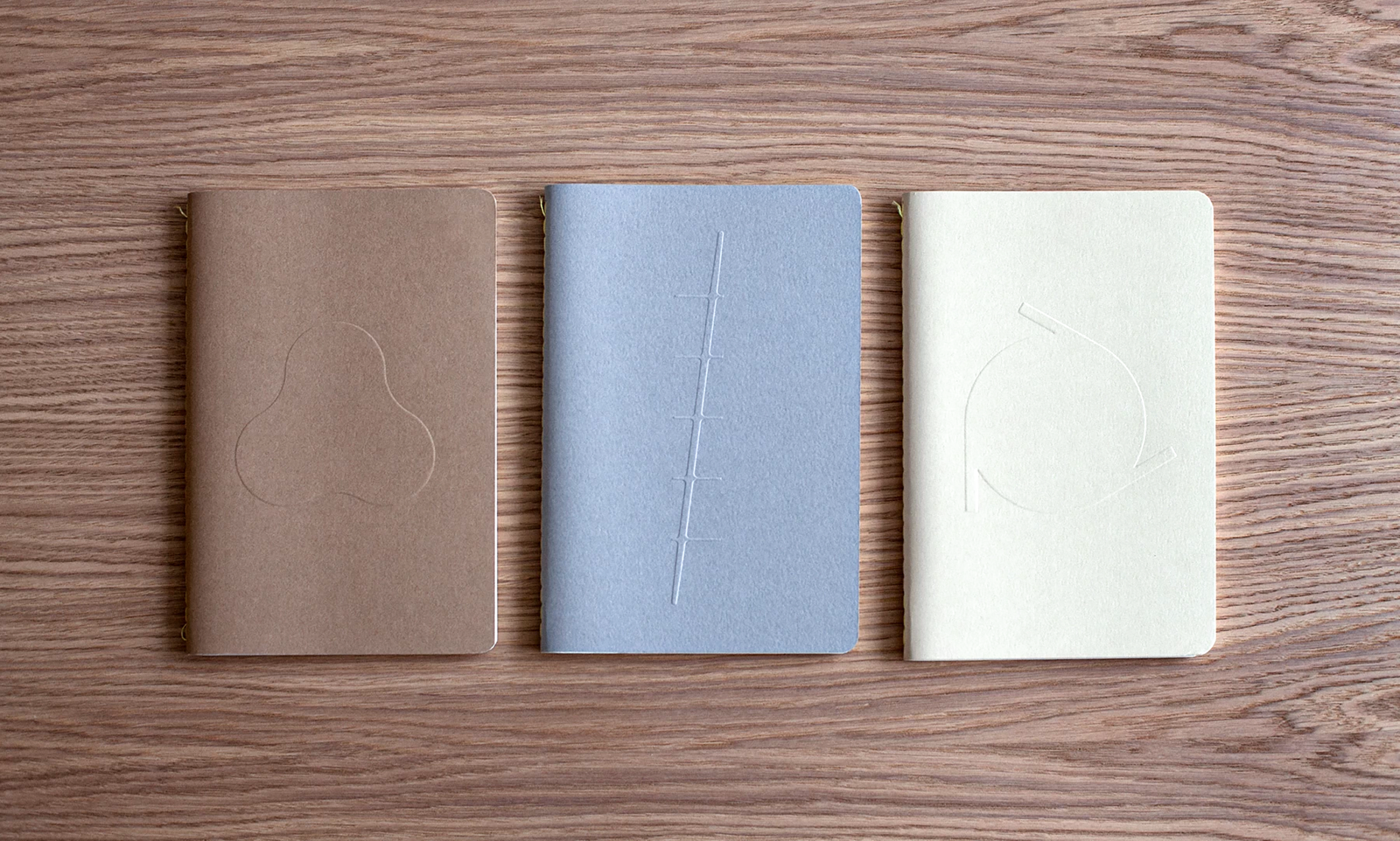 Branded notebooks with embossed shapes of products