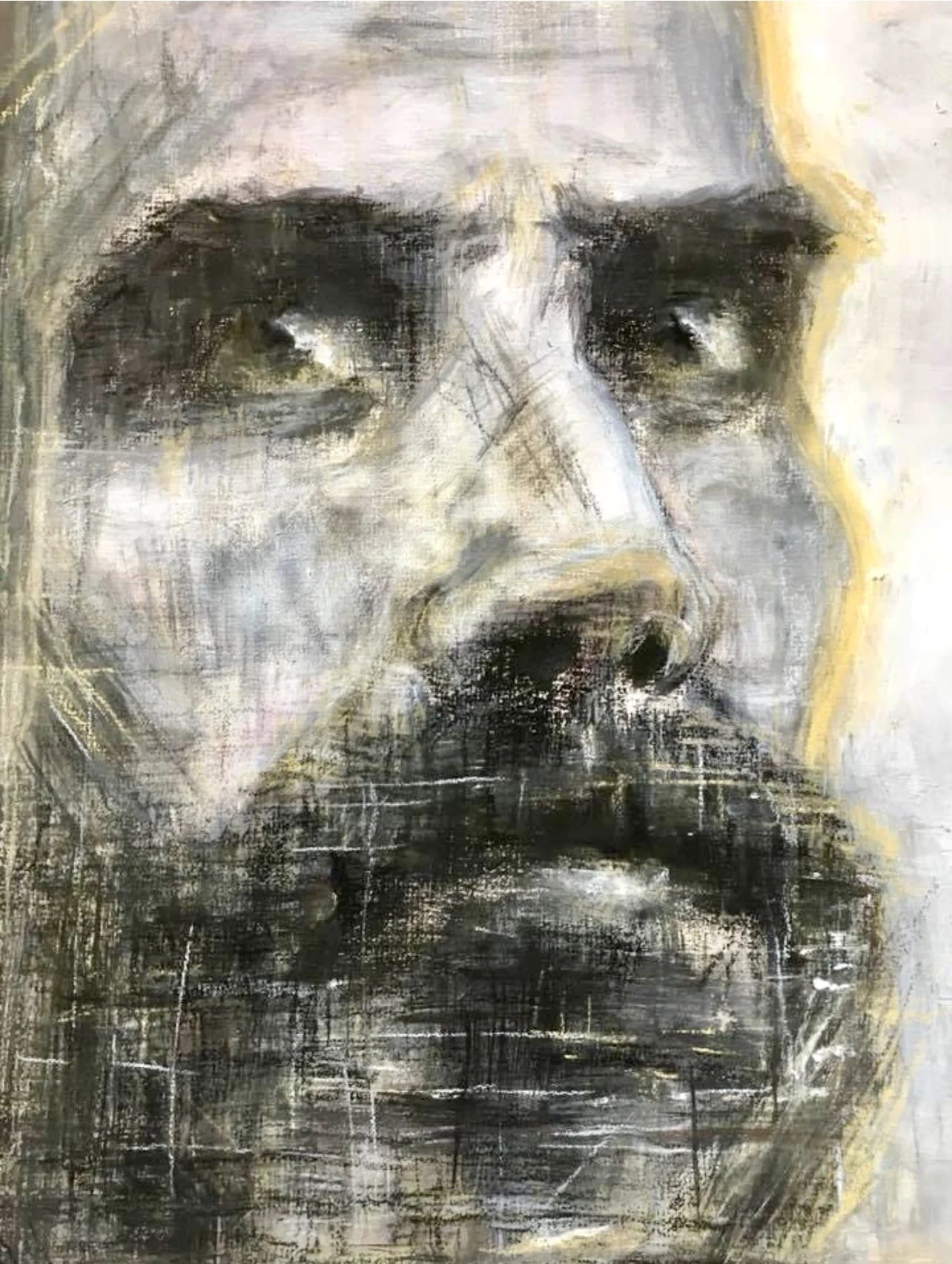 Abstract portrait of a man's face with a beard, depicting intense eyes and expressive pencil and charcoal strokes.