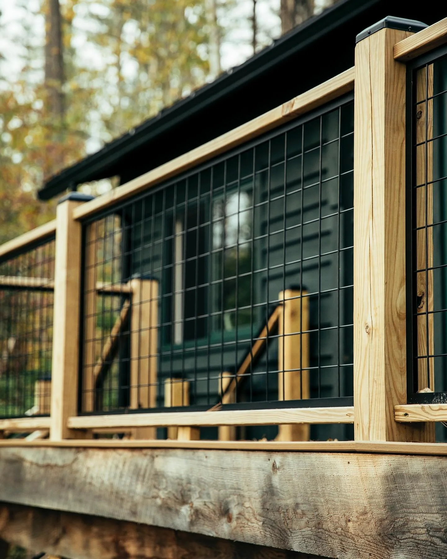 A closeup of the wood and welded mesh railing detail at the Lakeview Cabin in Stockbridge, MA. This was a solution for proving visual transparency through the railing from the deck without introducing glass, which just didn&rsquo;t feel right for thi