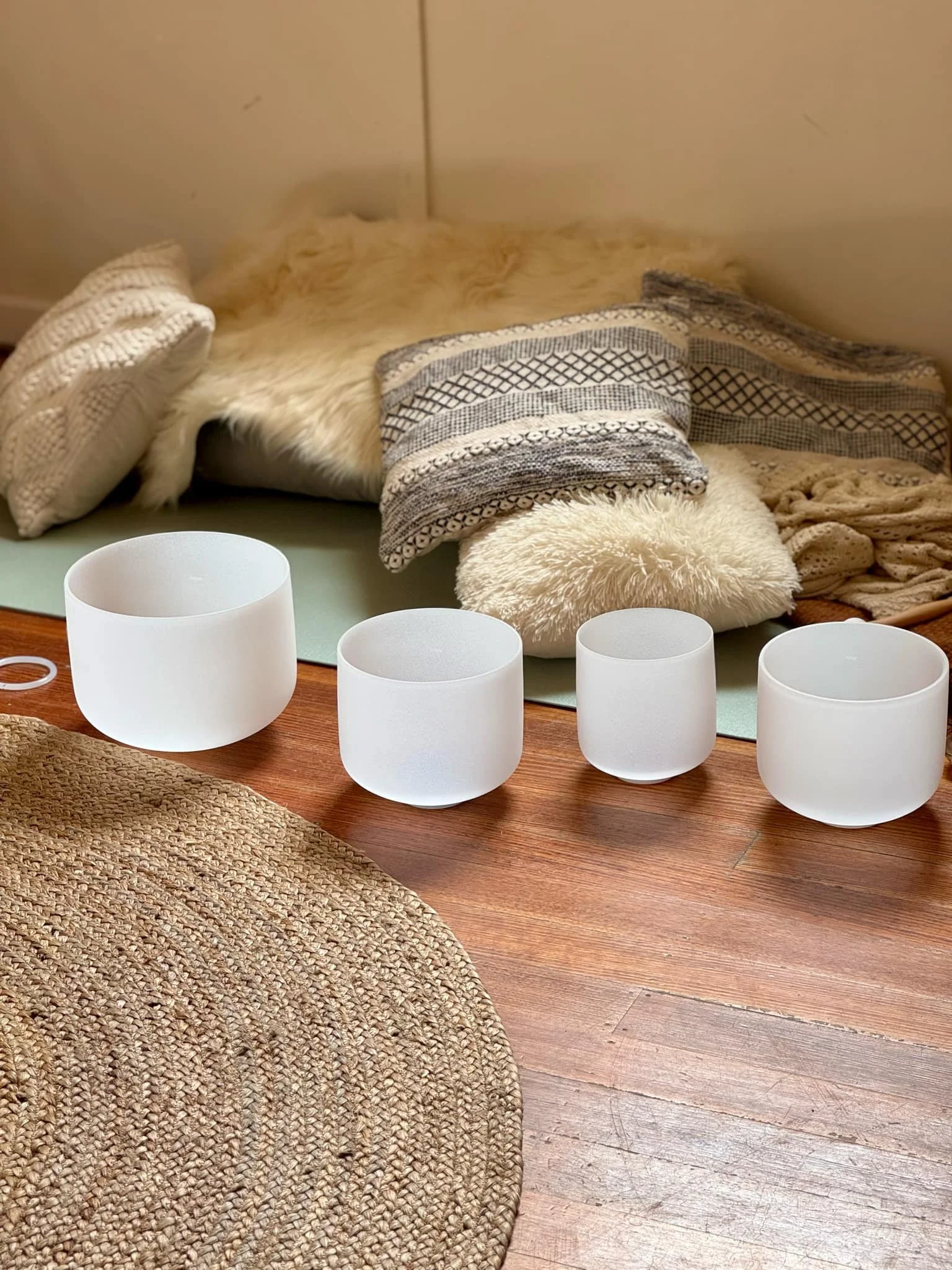Crystal singing bowls set up for a sound therapy session in Hobart and the Huon Valley