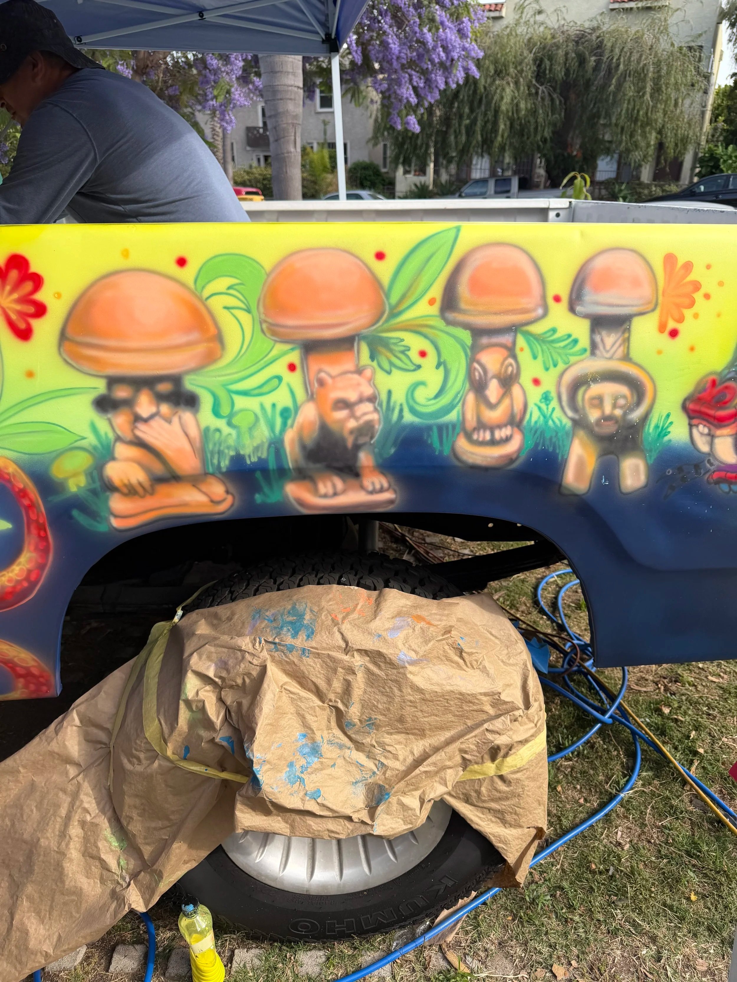 Hand-painted vintage Dodge truck featuring The Watchful Four mural artwork by Memuco.