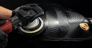 Professional car buffing and polishing service at Ithaca Elite Detailing in Ithaca, NY, using a FLEX orbital polisher to restore paint clarity and shine.