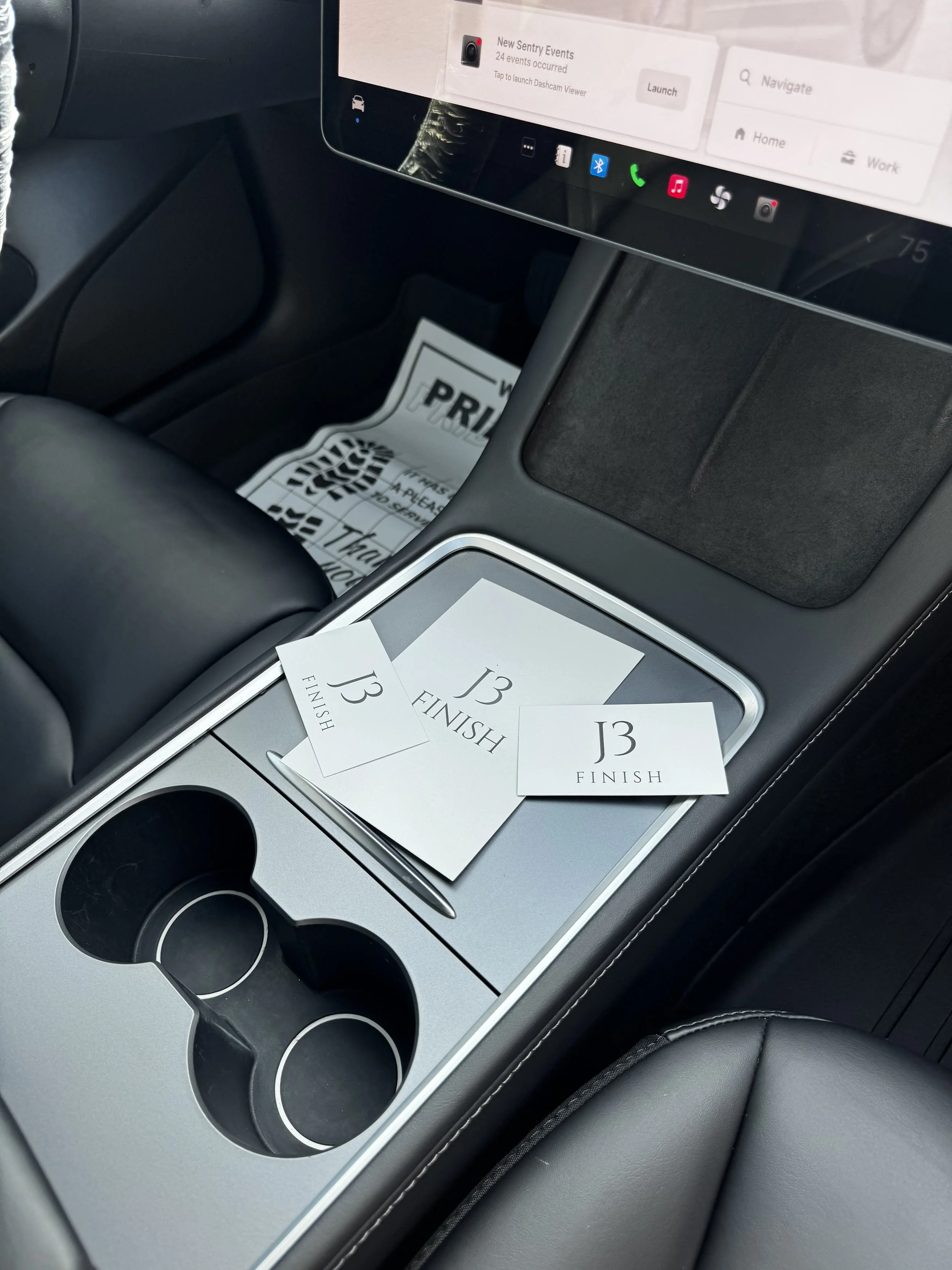 Tesla Model interior with tray holding three