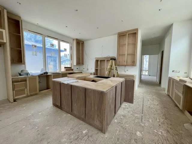 This is the kitchen where cabinets and island installation is starting