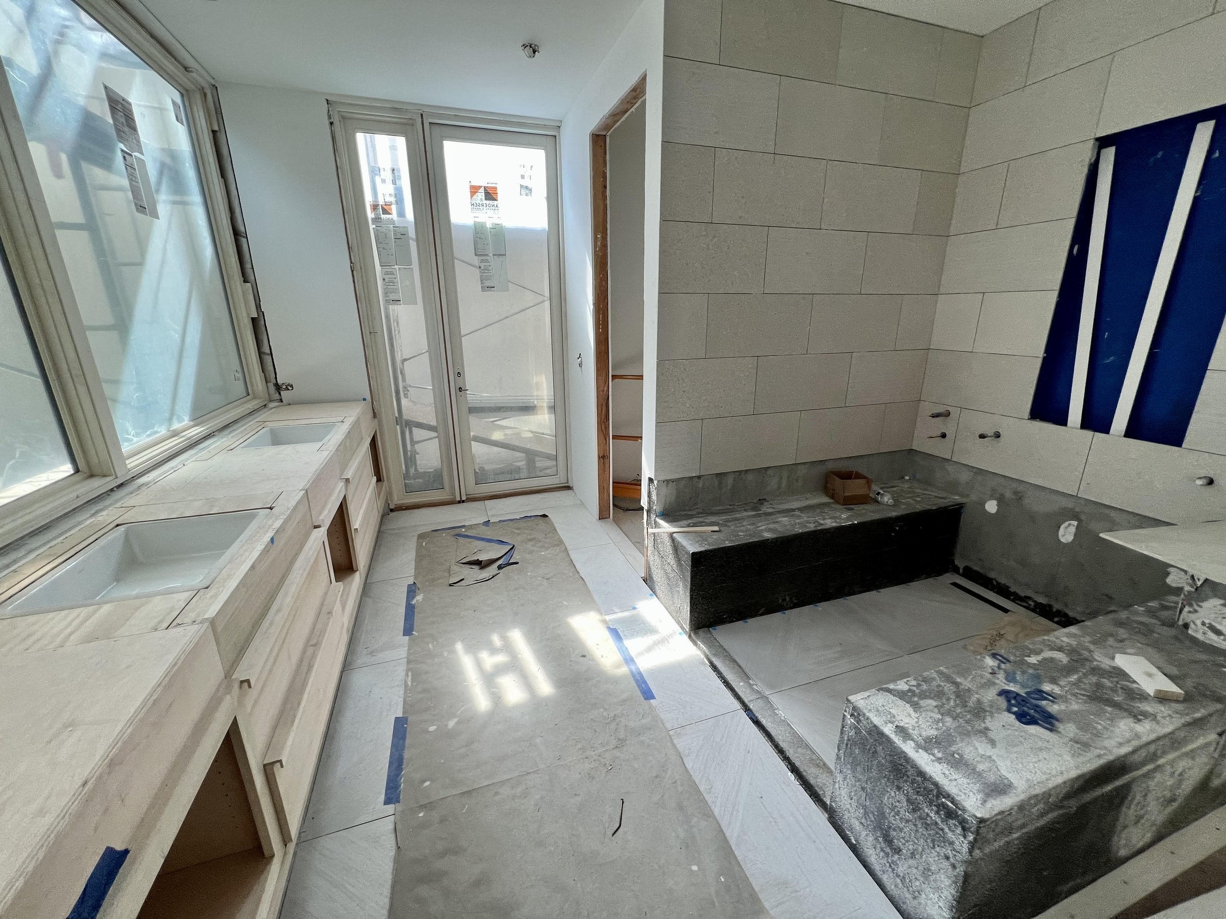 The underground (what light!) gym bathroom features tile on floors and some walls