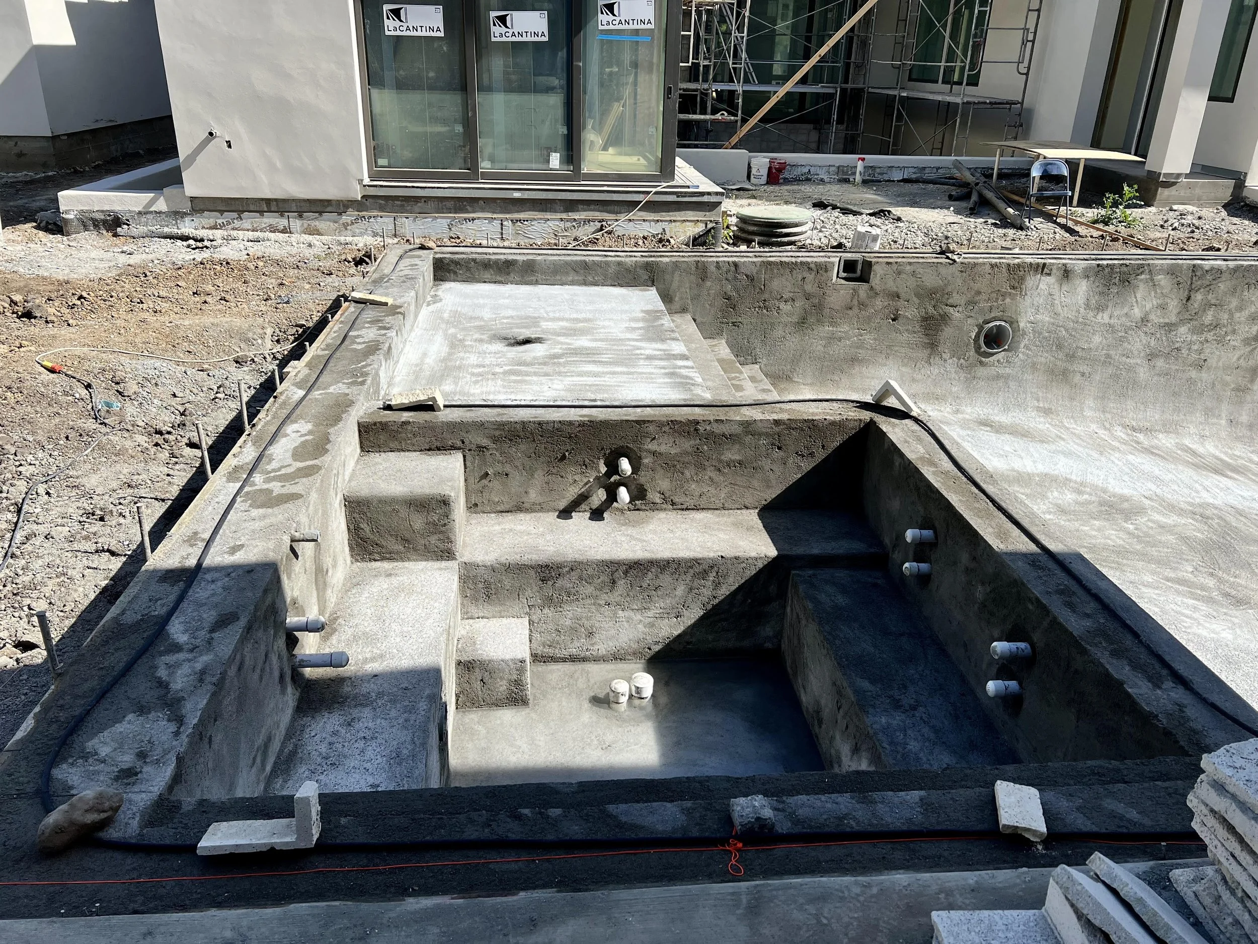 This is a picture of the beginning stages of the hot tub and pool area