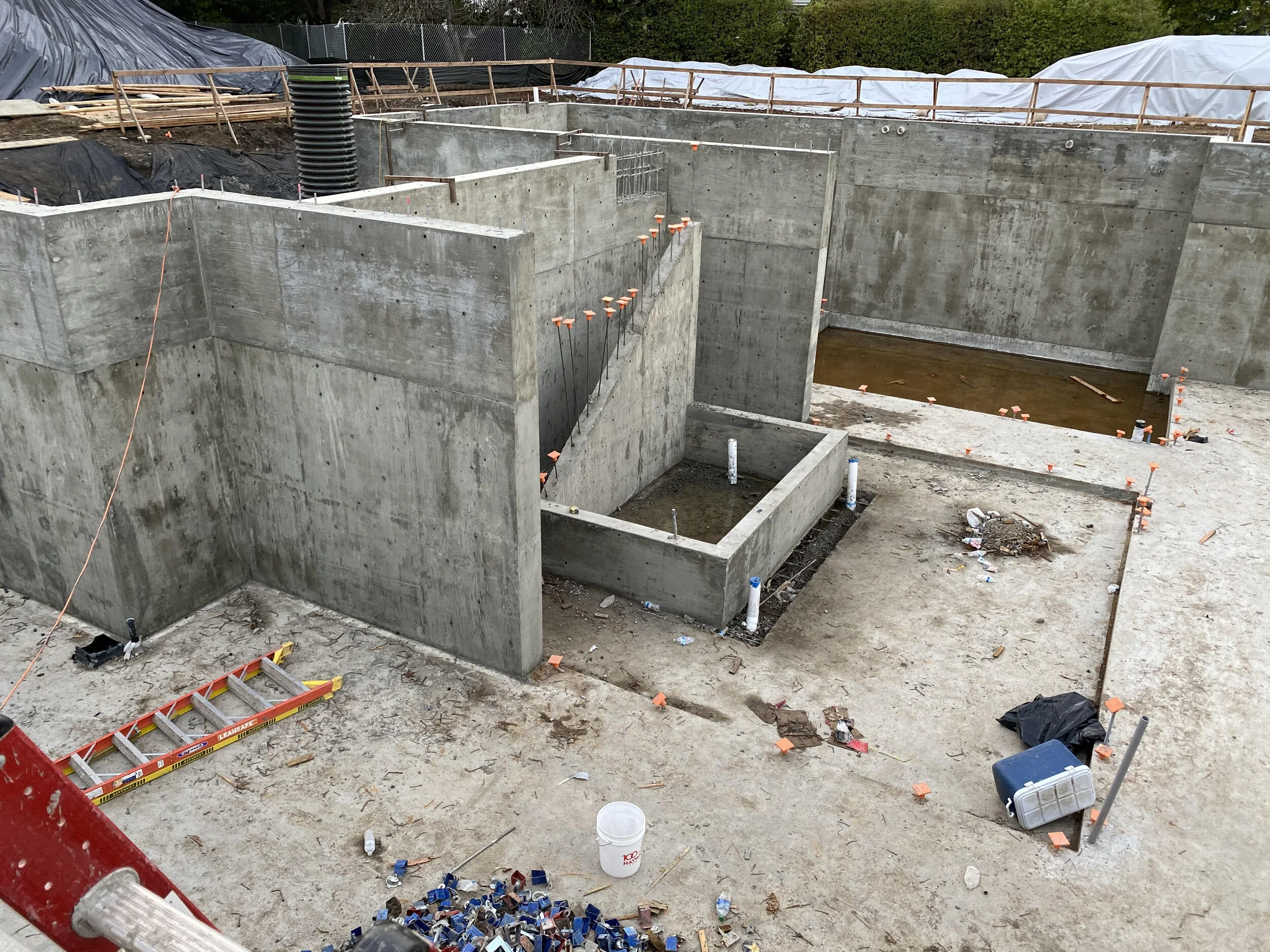 Behold… our future sunken patio!  The entire home wraps around this courtyard.  We design homes for functionality and durability, but also “wow moments” like this.  Can you see the wow?
