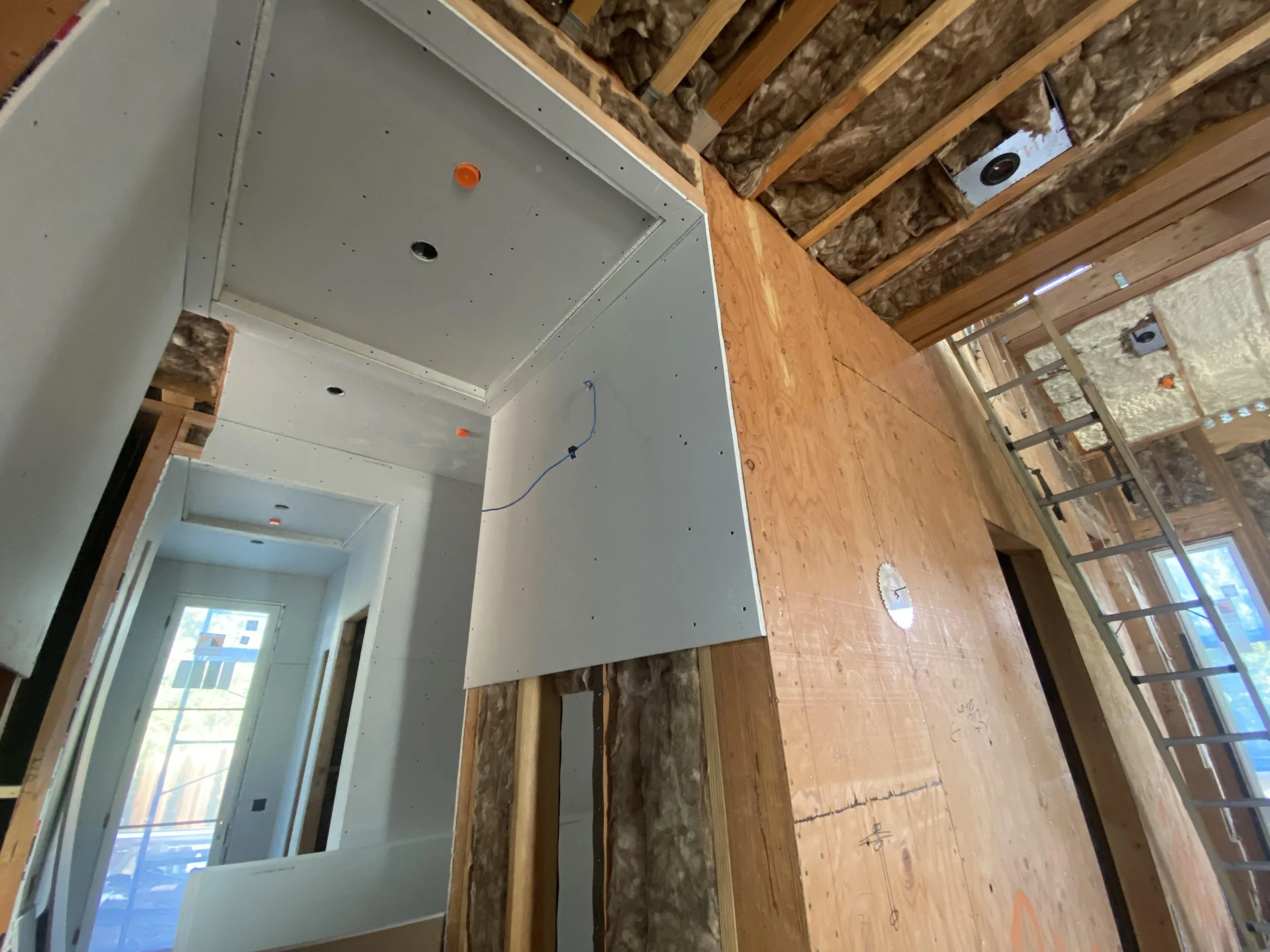On the inside of the house, the drywalling begins