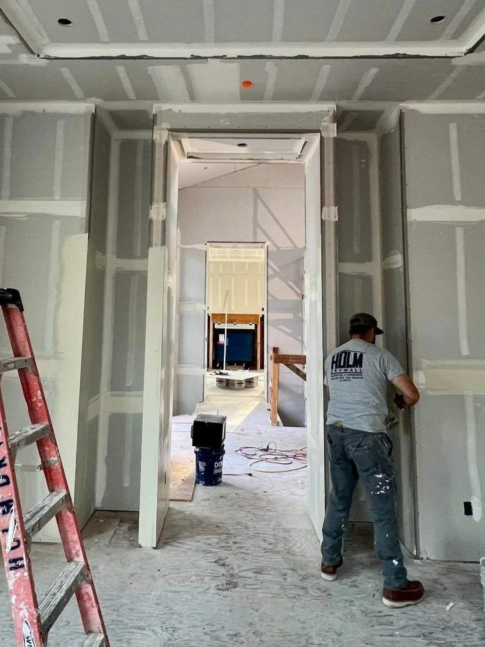The drywalling process is a symphony of sticky goop and fine particulate matter