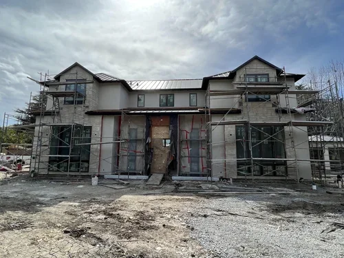 Final stucco, stone mounted