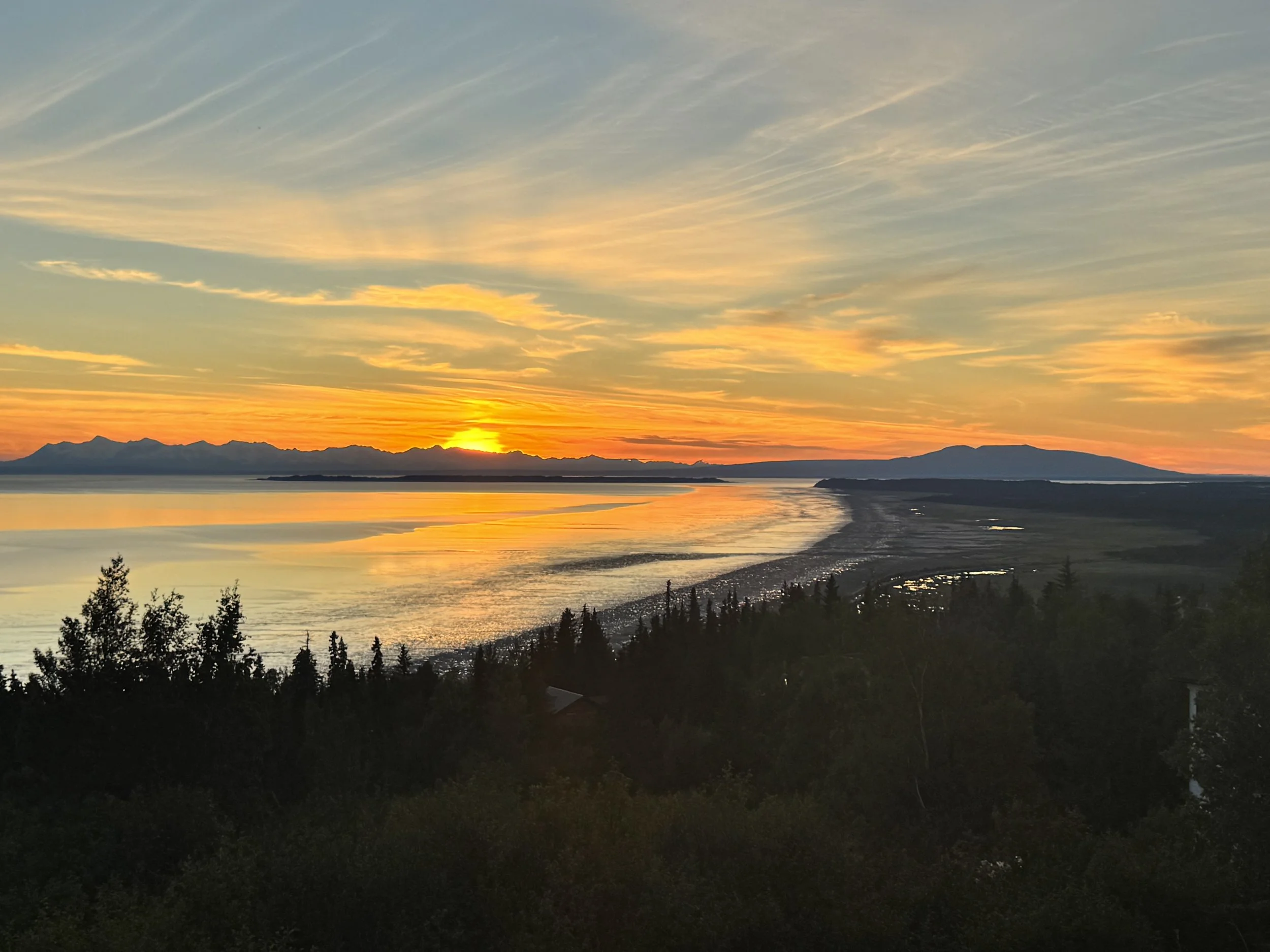 Sunset over Turnagain Arm, photographed by Authentic founder Kate Slyker from her Anchorage office.