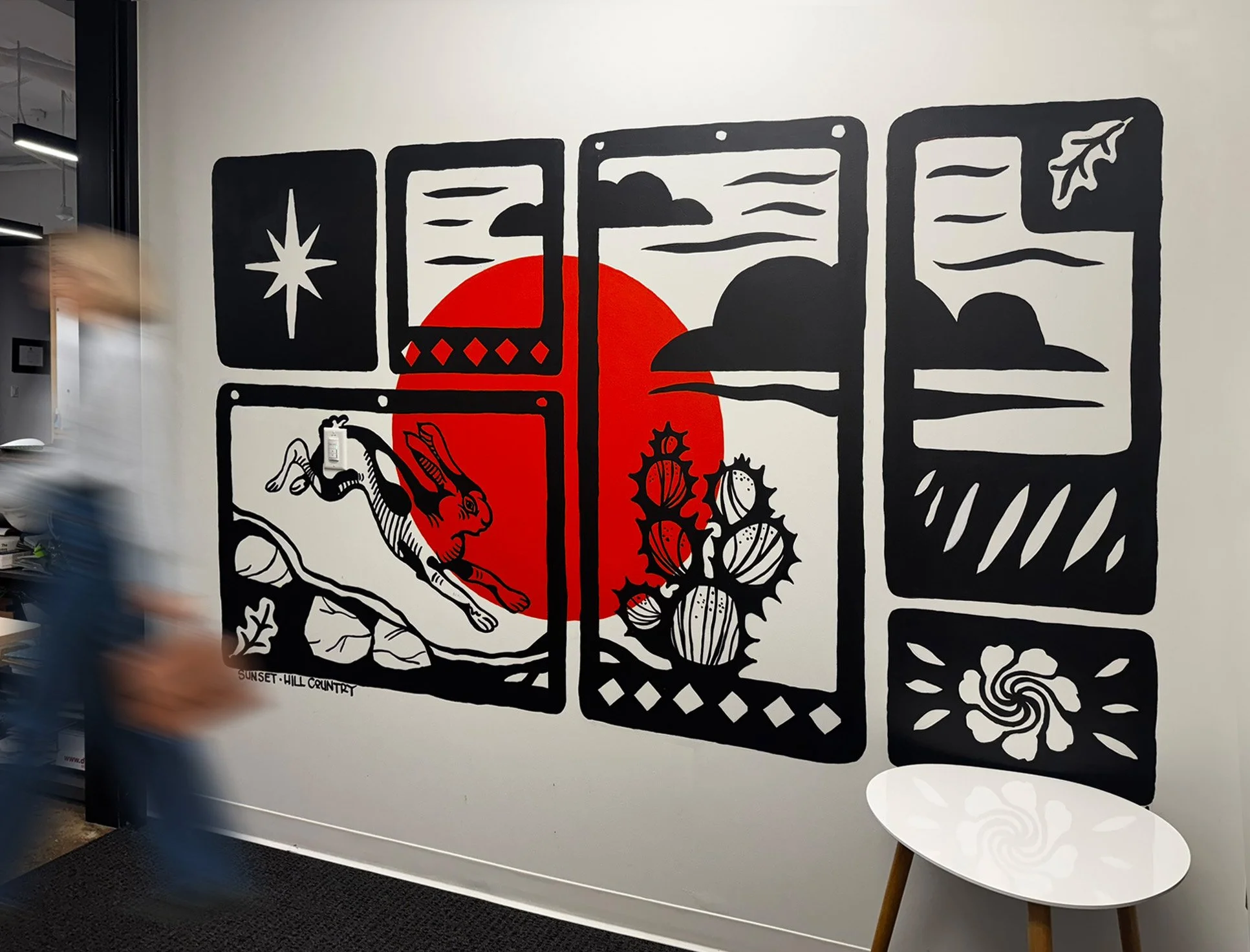 Office mural in woodcut style painted on wall