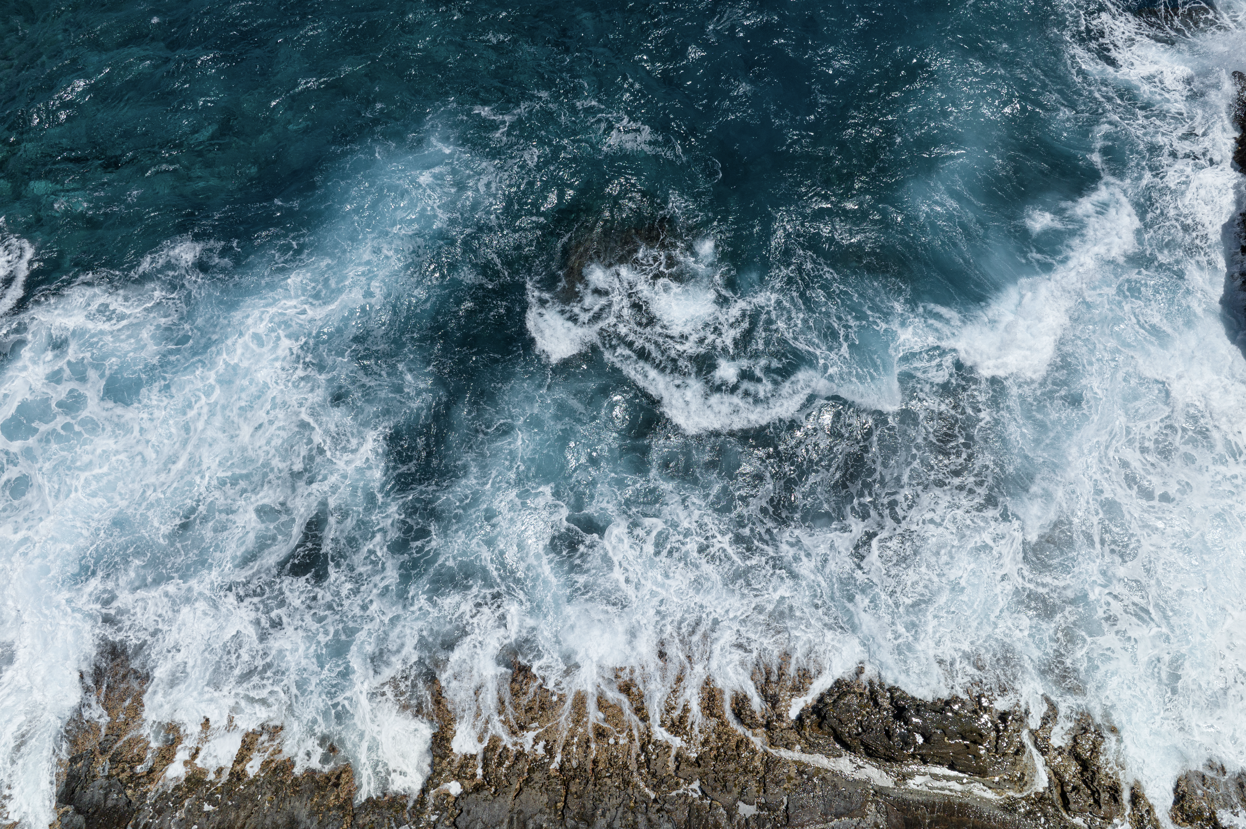 Ocean waves crashing against rocks