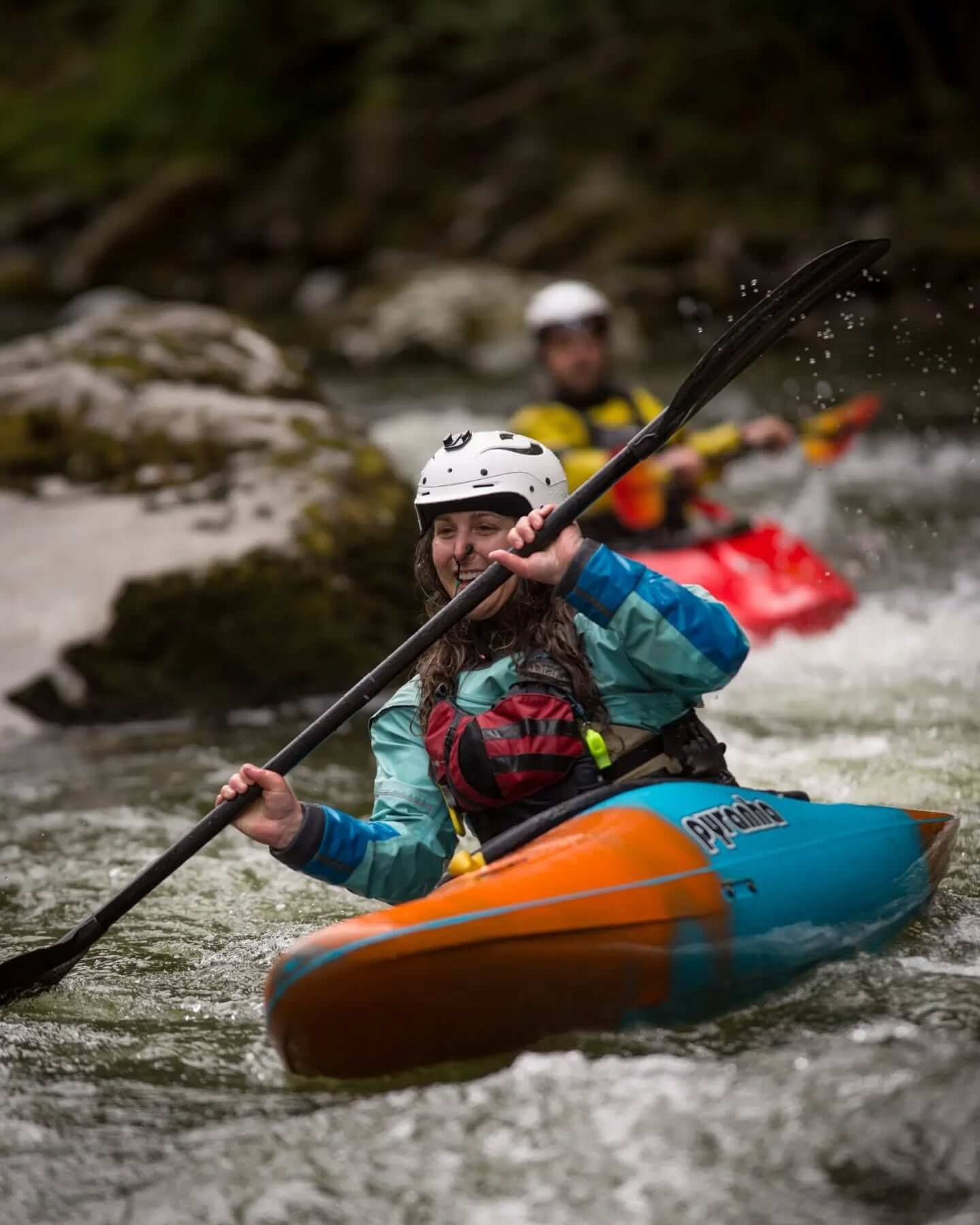 From above hands of unrecognizable woman rubbing aromatic spices into piece of raw meat over parchment paper