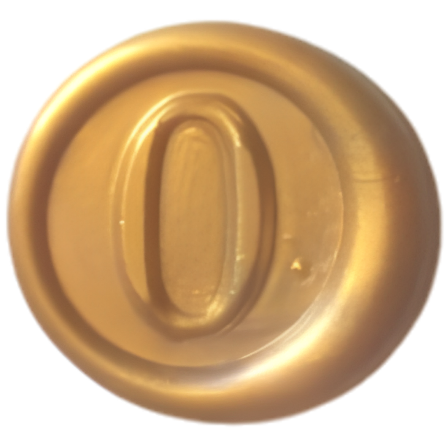 Close-up of a golden metallic object with concentric circular ridges, possibly a spinner or decorative item.