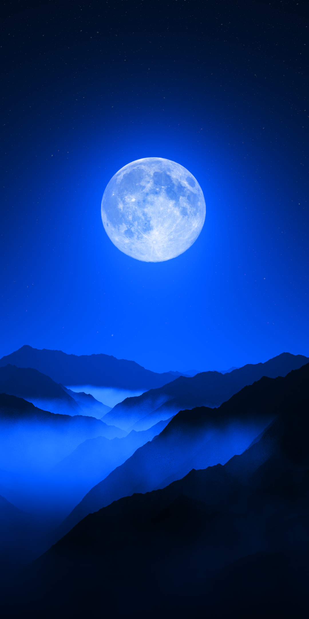 A bright full moon rising above mountain ranges with blue sky and scattered stars.