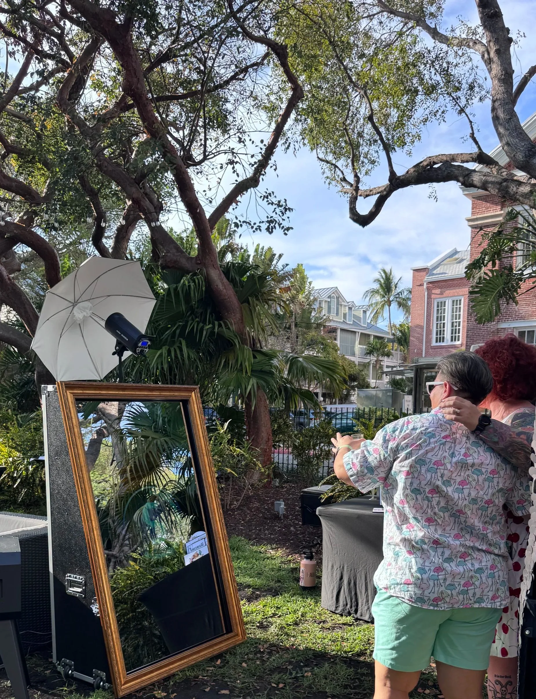 Guests take a fun photo at the photo booth rental in Key West Florida provided by Conch Cam Photo Booth Rentals