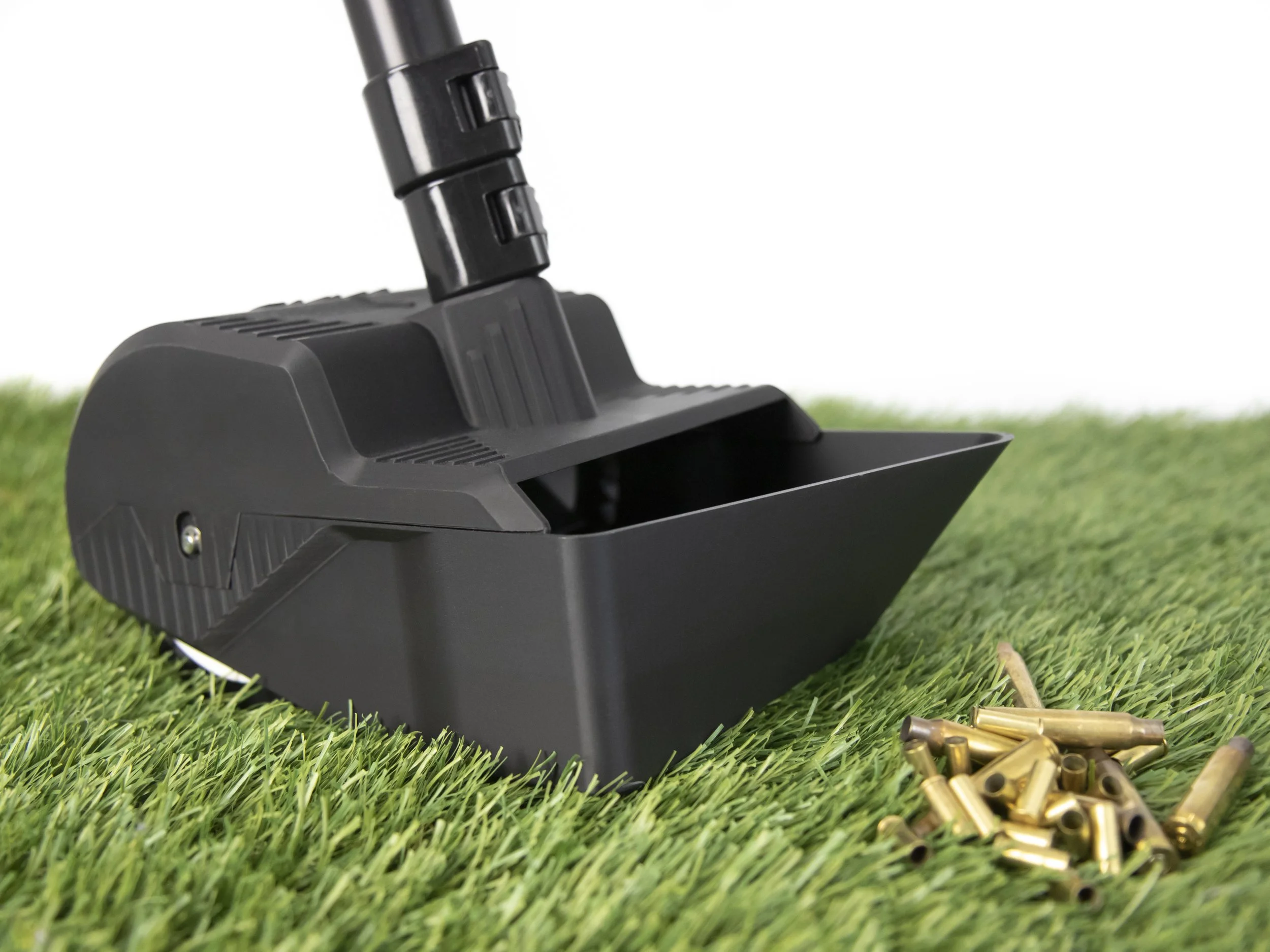 Grass Scavenger on grass with loose brass casings nearby