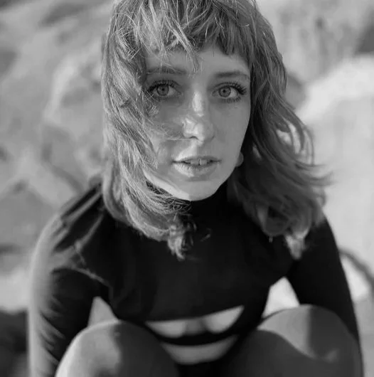  Alex Foy 

 Alex is a queer and versatile artist with a lifelong pursuit of the weird. While pursuing her BS in Psychology and Dance at California Polytechnic University, she danced with Orchesis Dance Company, a pivotal experience to which she owes