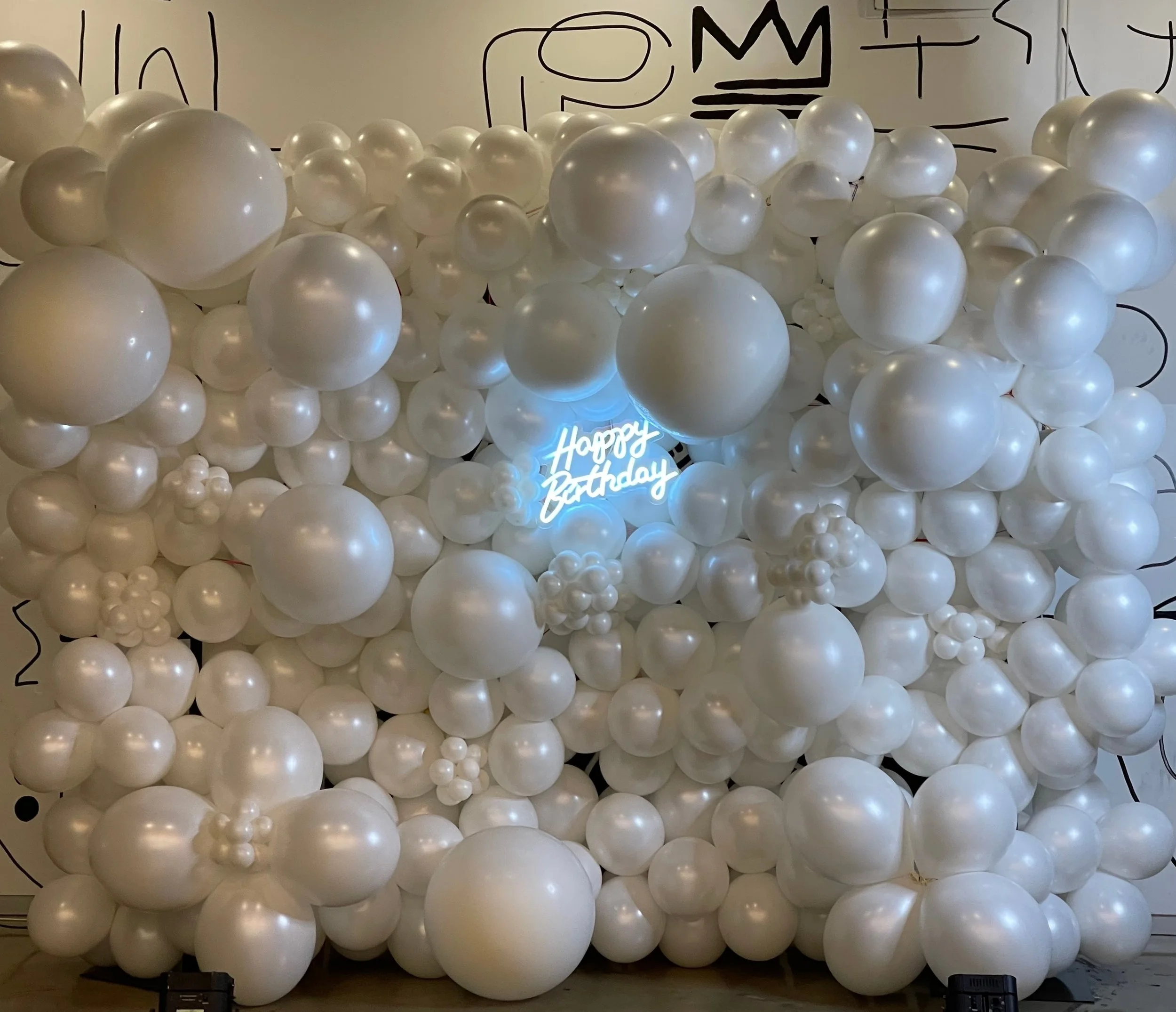 Balloon Wall with illuminated "Happy Birthday".