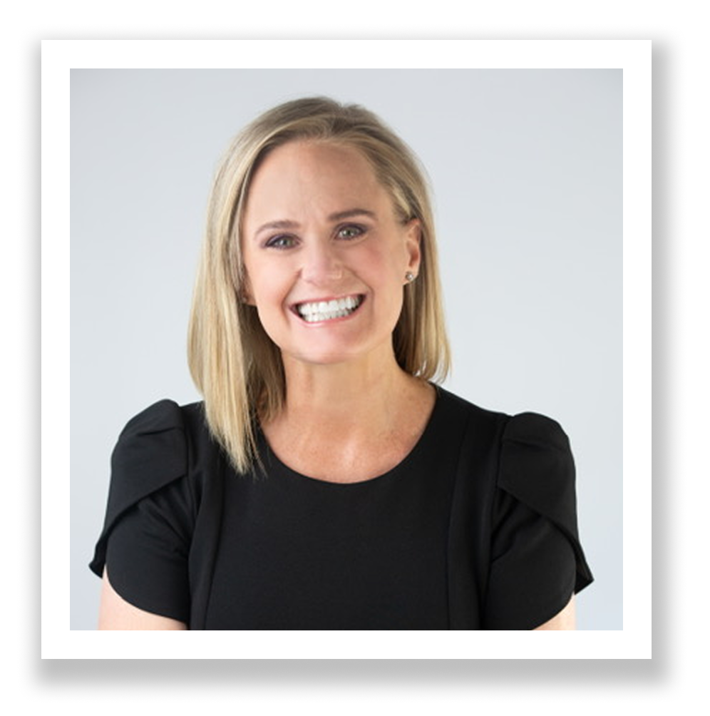 A professional woman who is a wedding coordinator with blond hair, smiling, wearing a black top with puff sleeves, against a light gray background.