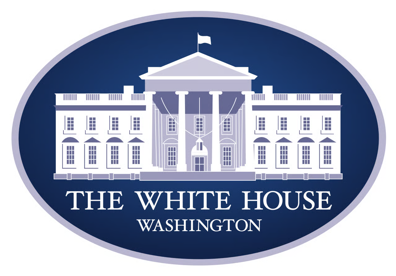 Illustration of the White House with the words "The White House Washington" underneath, depicted in white and blue colors within an oval shape.