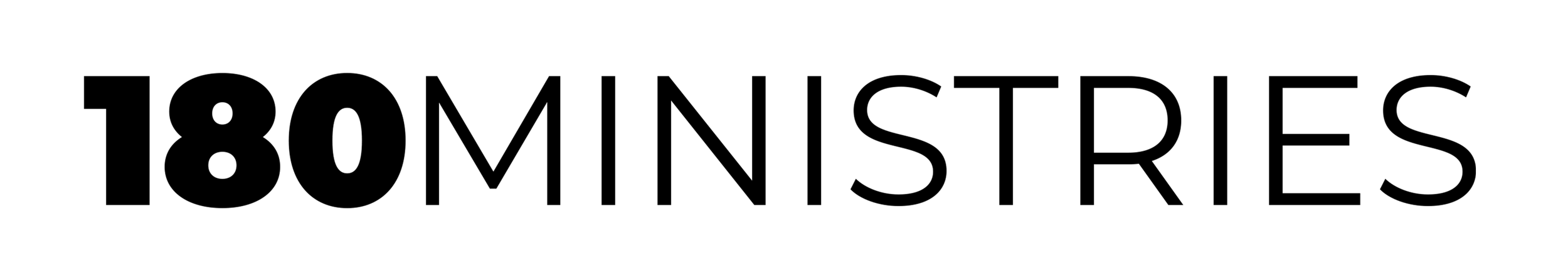 Close-up of a barbell with black weights on each side, and a silver bar in the middle, on a gym floor.