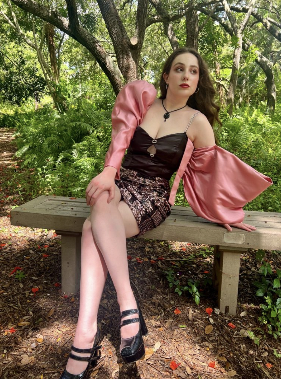 PAS DE DEUX CO-ORD – A sculptural two-piece inspired by ballet, balancing softness and structure. Featuring a duchess satin bustier with keyhole cutouts, rhinestone accents, and asymmetric detailing, paired with a ruched sequin mini skirt.