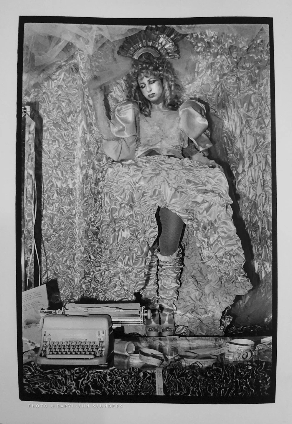 This is a black and white photograph by Daryl-Ann Saunders of performance artist Colette Lumiere, NYC, 1980s.