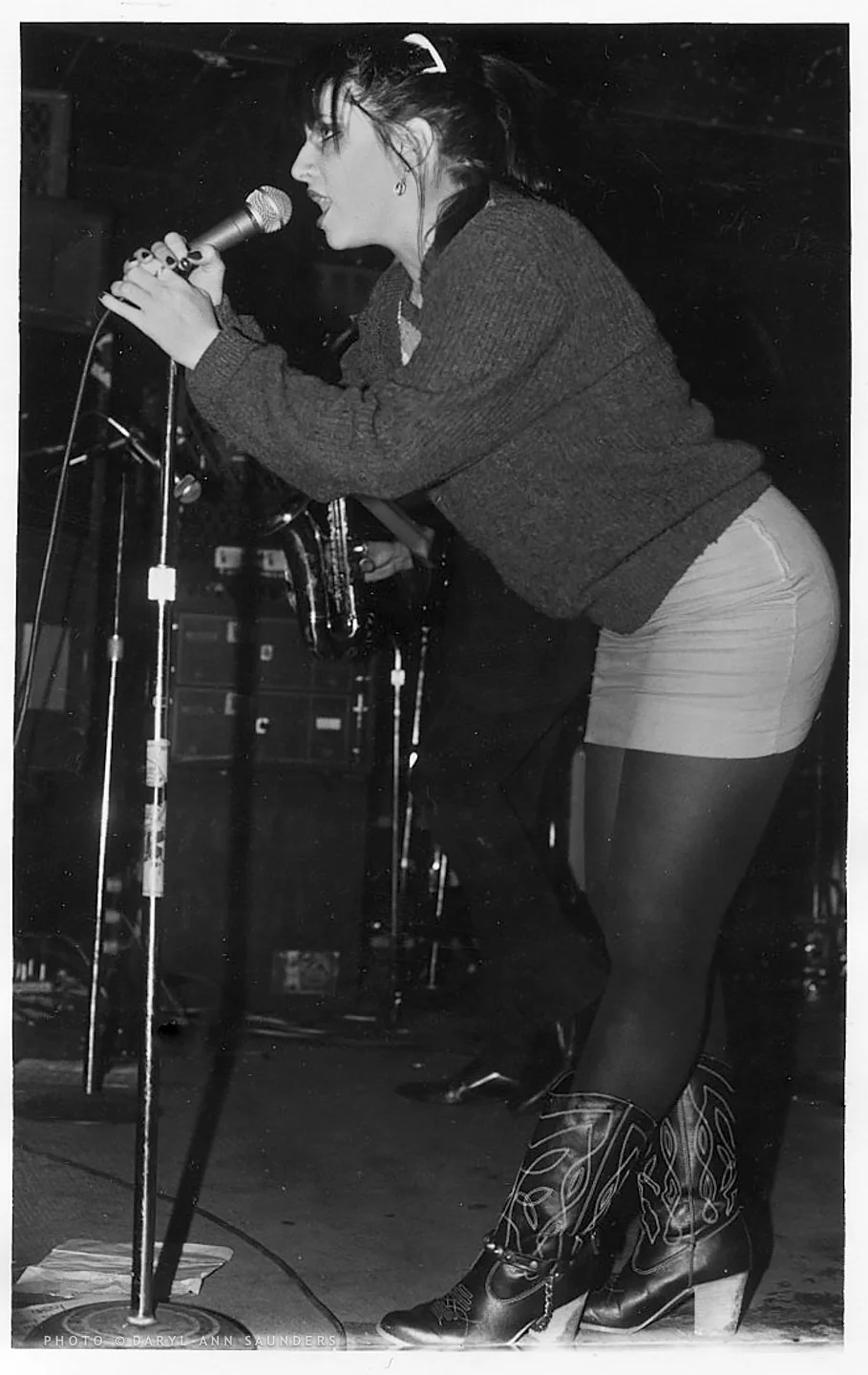Lydia Lunch, punk singer, singing at the microphone during 1980s in NYC