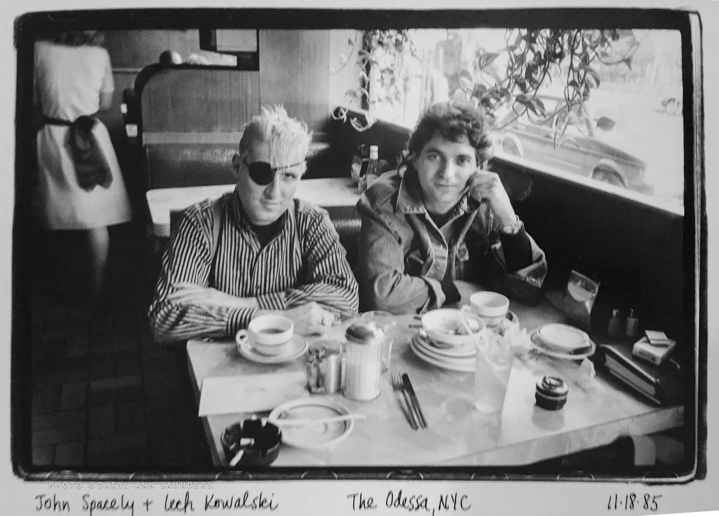 Actor John Spacely and Director, Lech Kowalski (of 1980s Gringo film), sitting in the Odessa  Restaurant, East Village, NYC, 1980s.