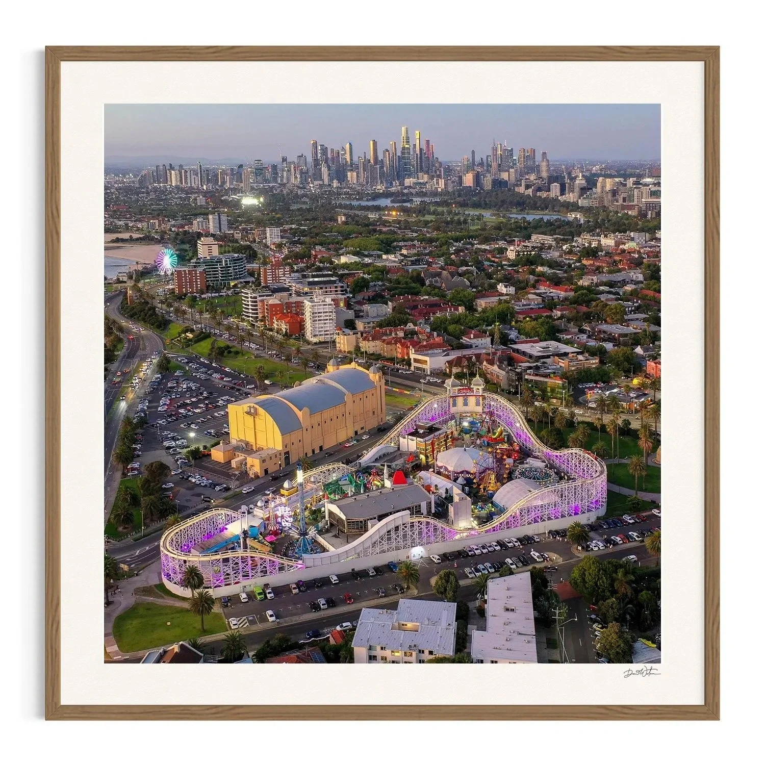 Dusk Over Luna Park by Dani Watson shown in a raw oak frame, a signed limited-edition fine art photography print from IRID Gallery