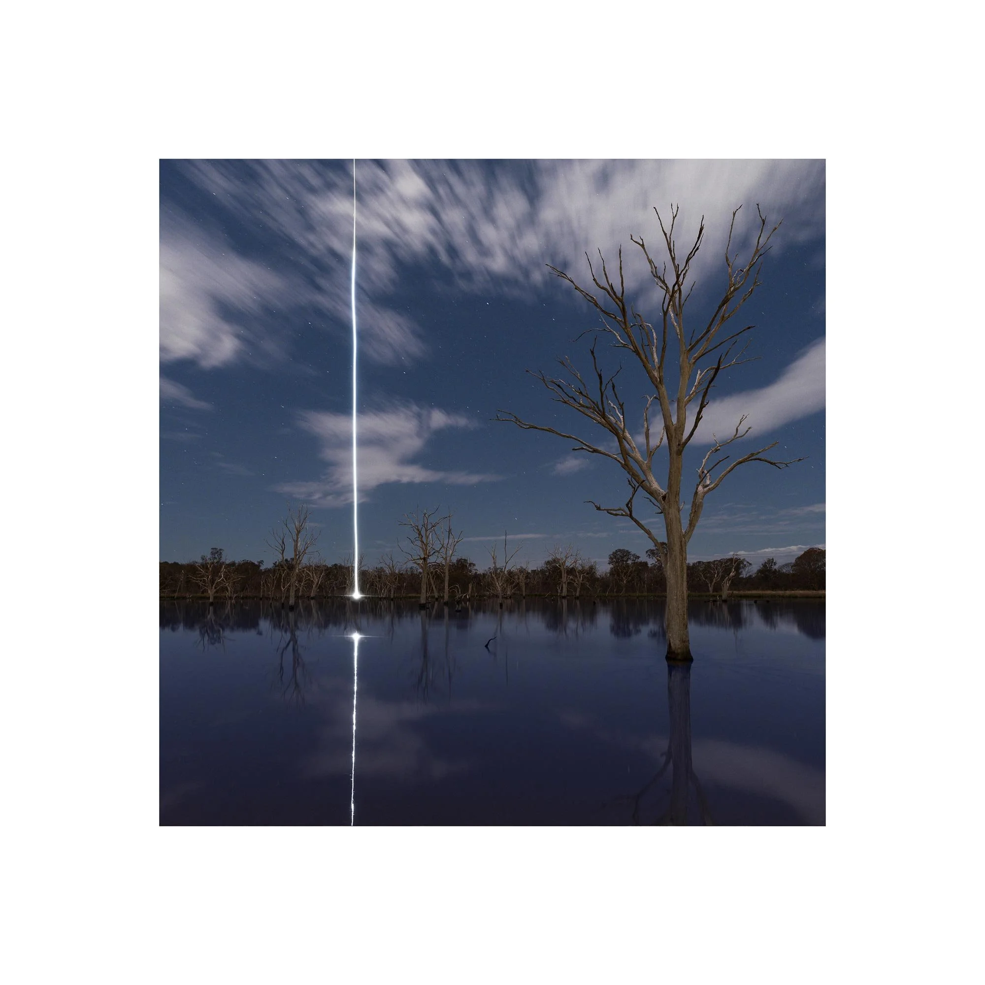 Ascent, a night landscape photograph with a vertical line of light by Dani Watson