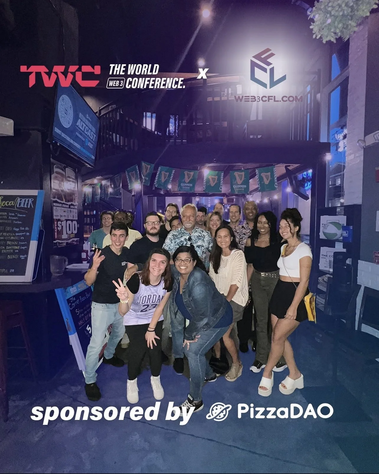 Group of people gathered together at a pub or bar decorated with Guinness banners, celebrating or attending an event sponsored by PizzaDAO and Web3 CFA.