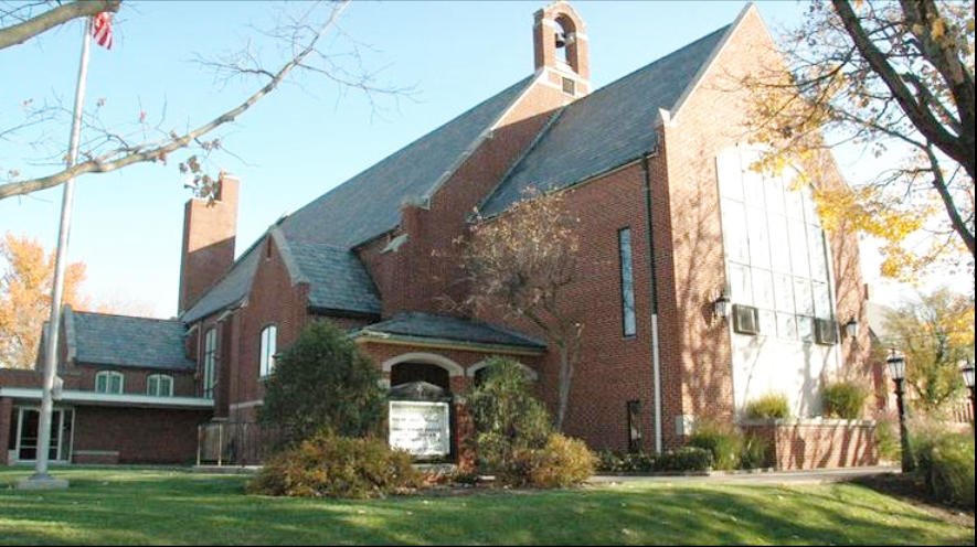 ELC church, surrounded by trees and lawn.