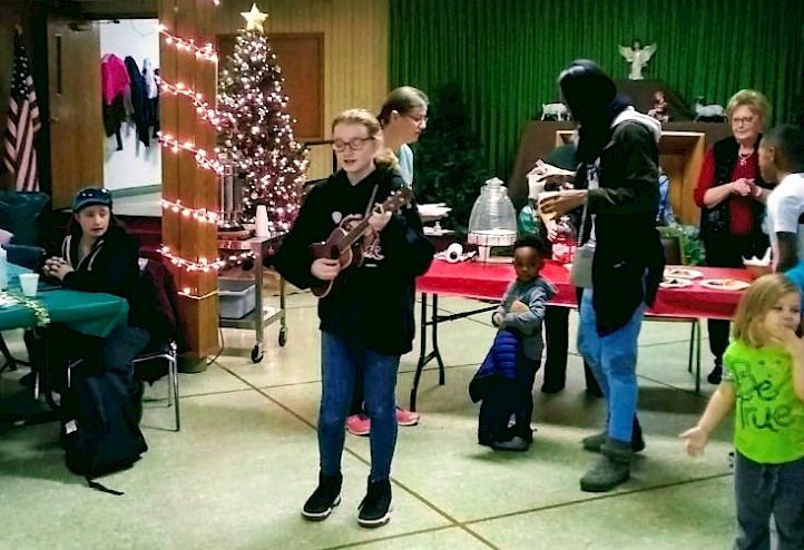 Playing guitar at church party