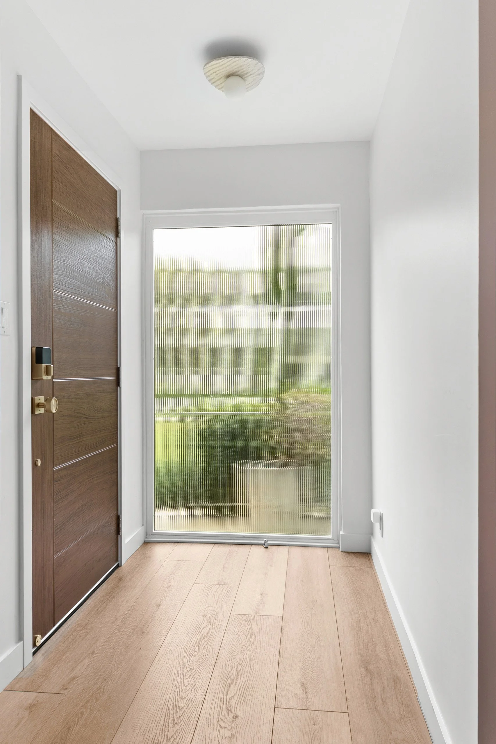 entry-reeded-glass-window-walnut-front-door-la-jolla.jpg
