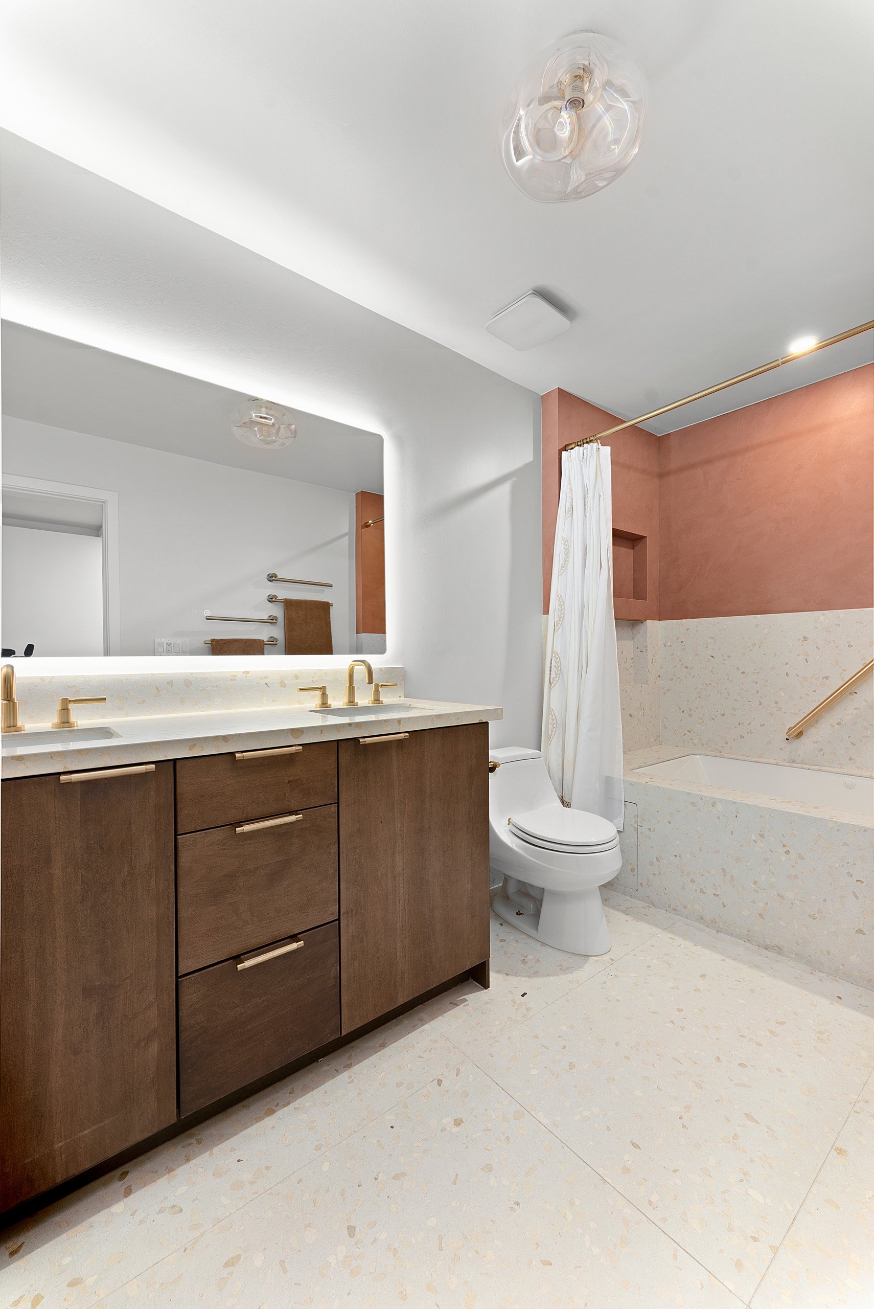 kids-bathroom-double-vanity-terrazzo-floor-backlit-mirror-la-jolla.jpg