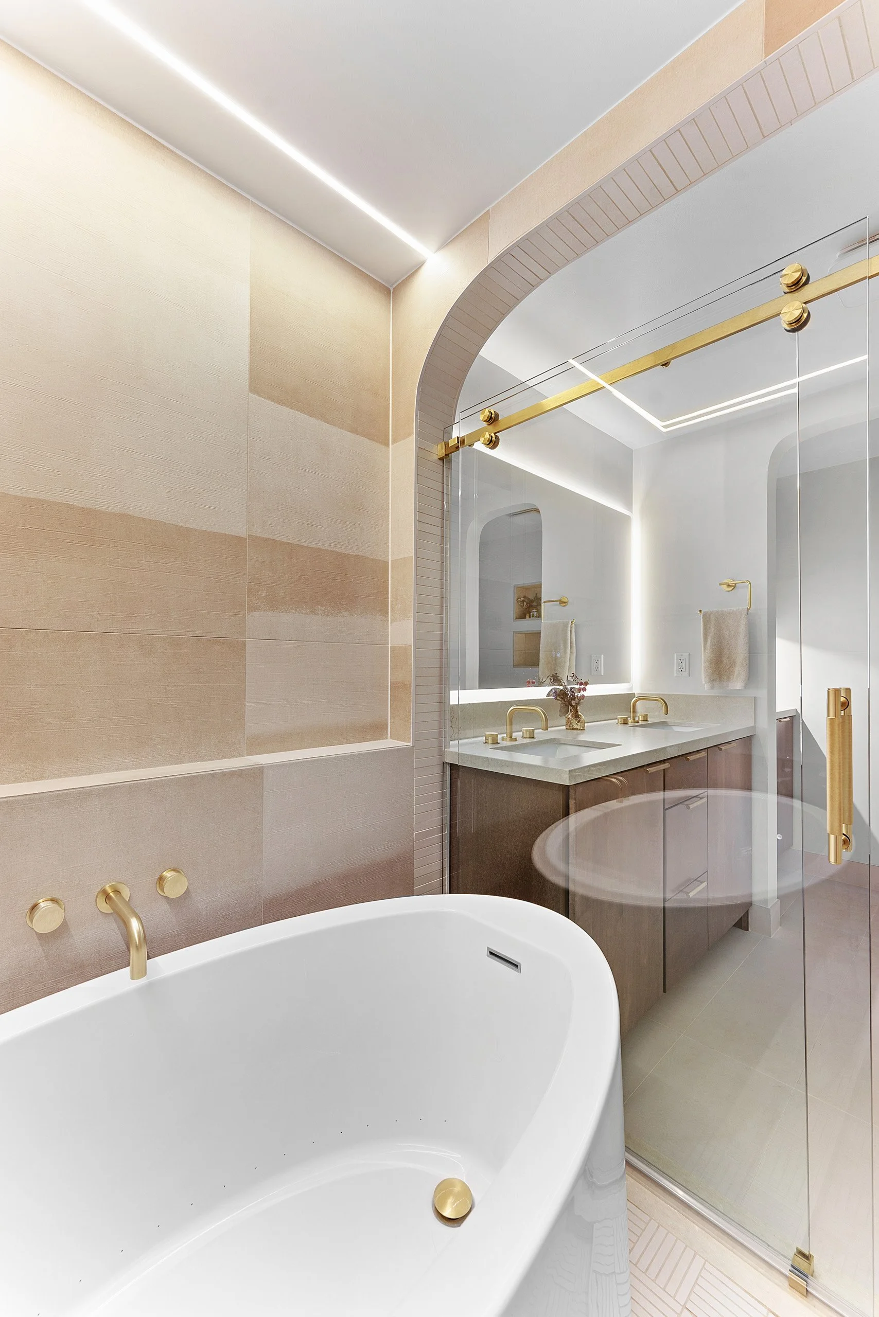 soaking-tub-arched-doorway-brass-tub-filler-primary-bath-la-jolla.jpg