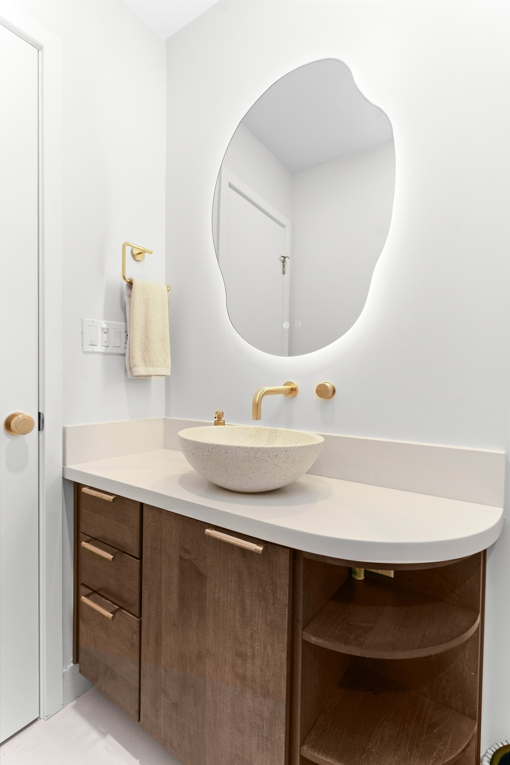 la-jolla-guest-bathroom-remodel-curved-vanity-terrazzo-vessel-sink-the-designers-firm.jpg