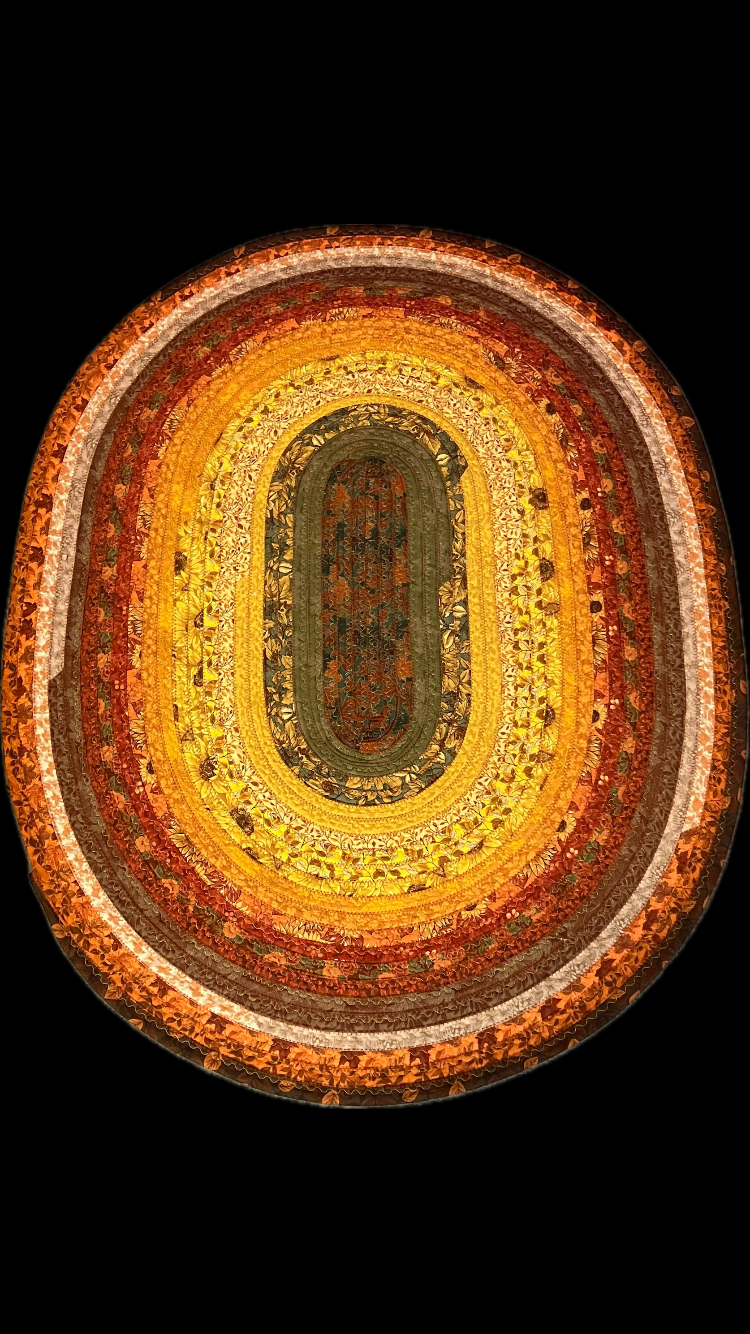 Orange brown yellow autumn fall colors handmade quilted puffy artisan cotton jelly roll rug