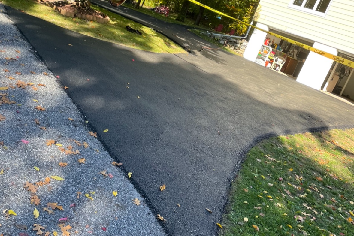 Sealcoating driveway in Gardiner NY with fresh black finish