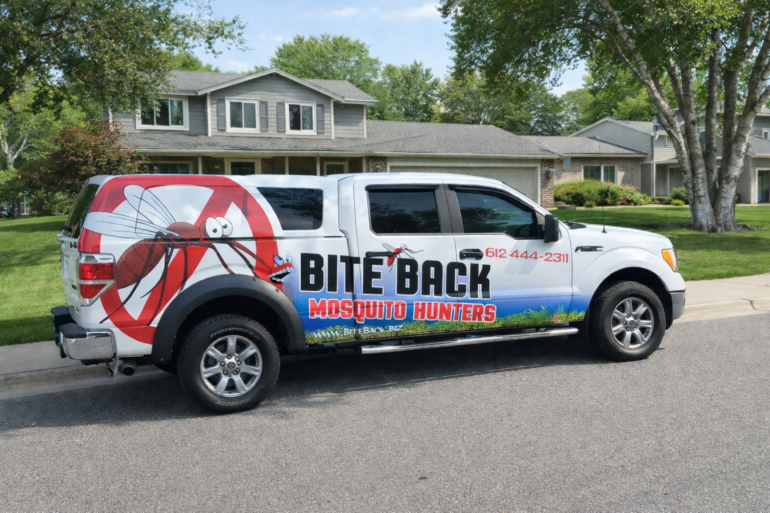 The new spraying truck for killing ticks and mosquitoes parked in front of a large lot to keep ticks and mosquitos away from this Blaine home and property.