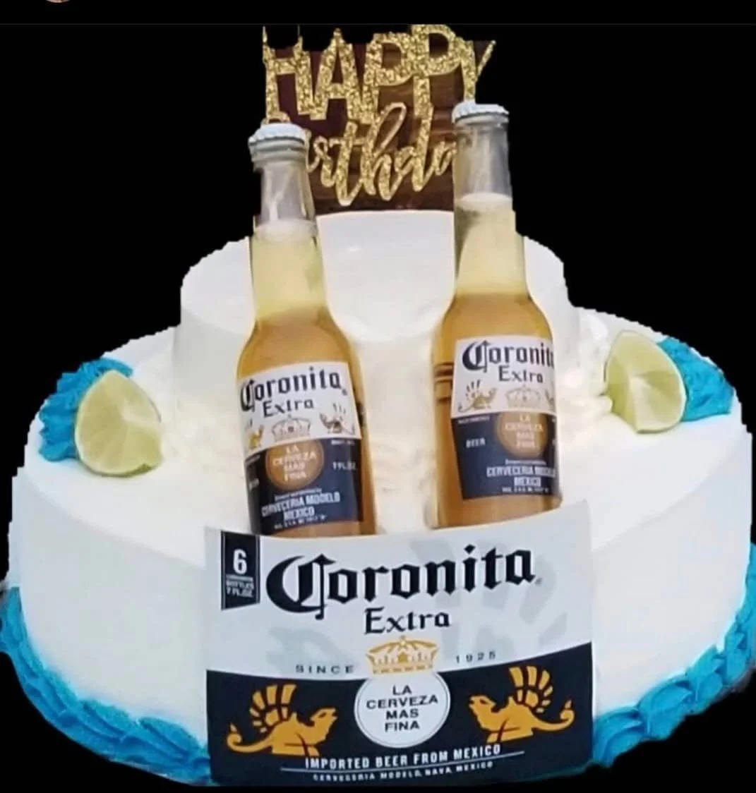 A cake decorated with Corona beer bottles, lime slices, and a 'Happy 21st' topper, celebrating a 21st birthday.