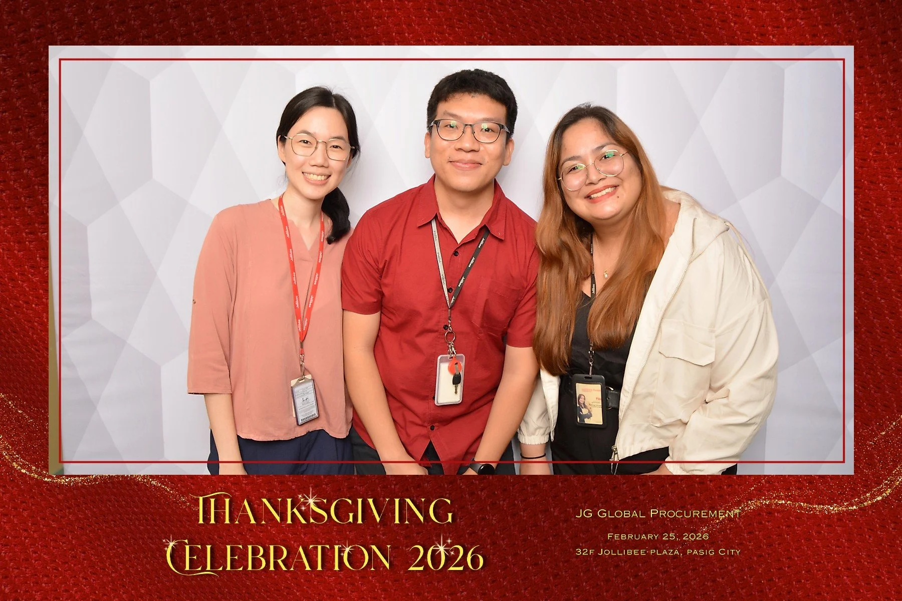 Three smiling people standing in front of a white patterned background at a Thanksgiving celebration event, with a red and gold frame and text that reads "Thanksgiving Celebration 2026, JG Global Procurement, February 25, 2026, 32F Jollibee Plaza, Pa